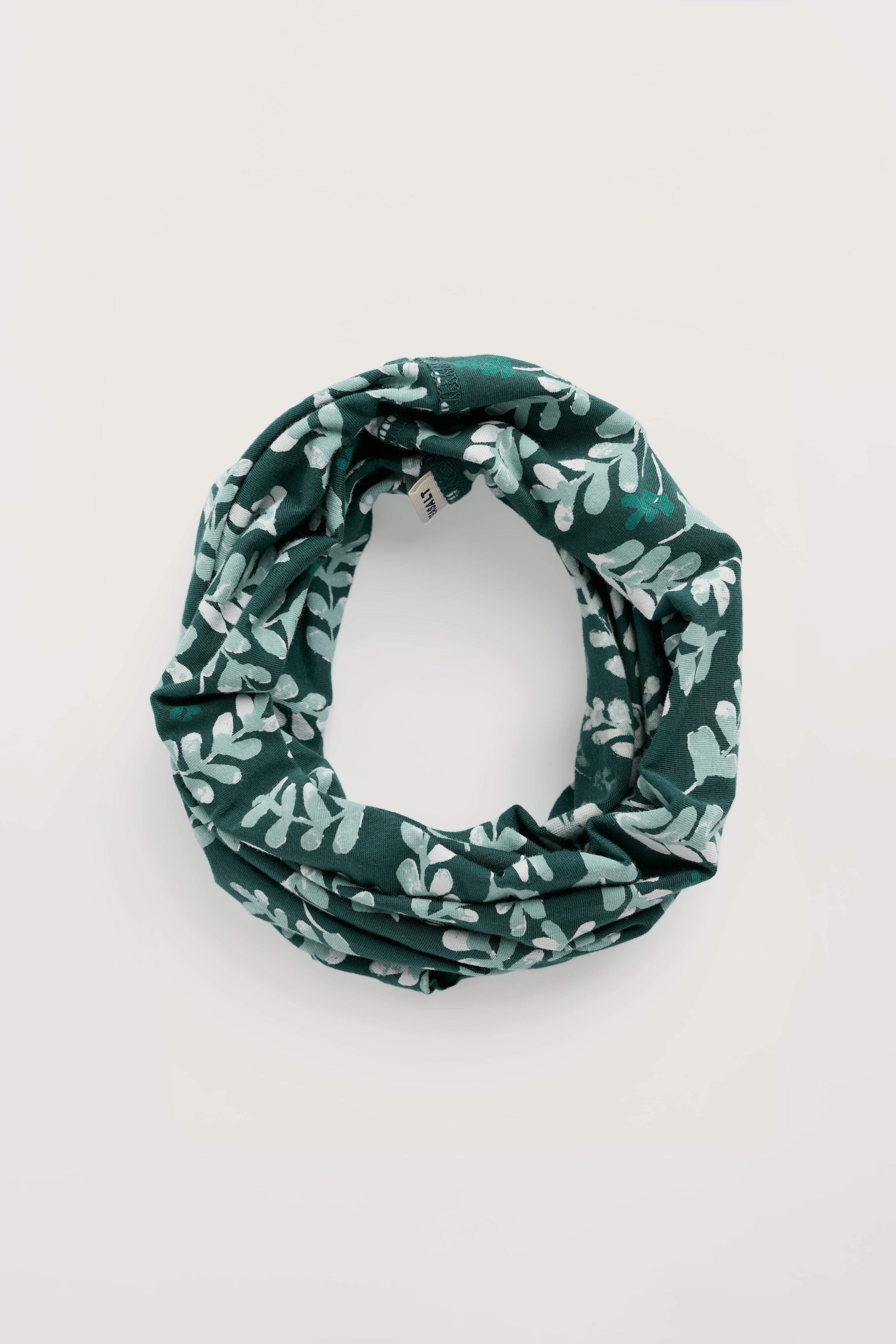 Green patterned snood on a white background
