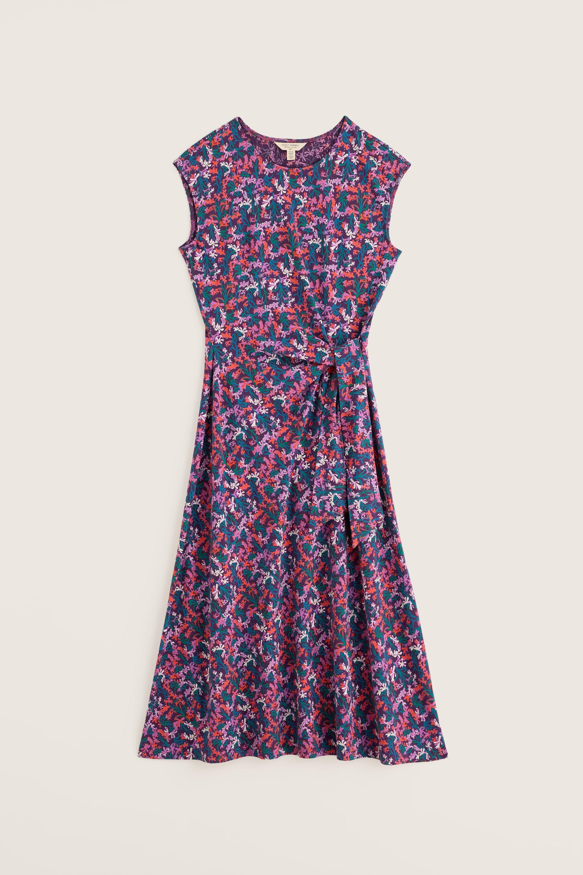 Floral patterned dress on a light beige background