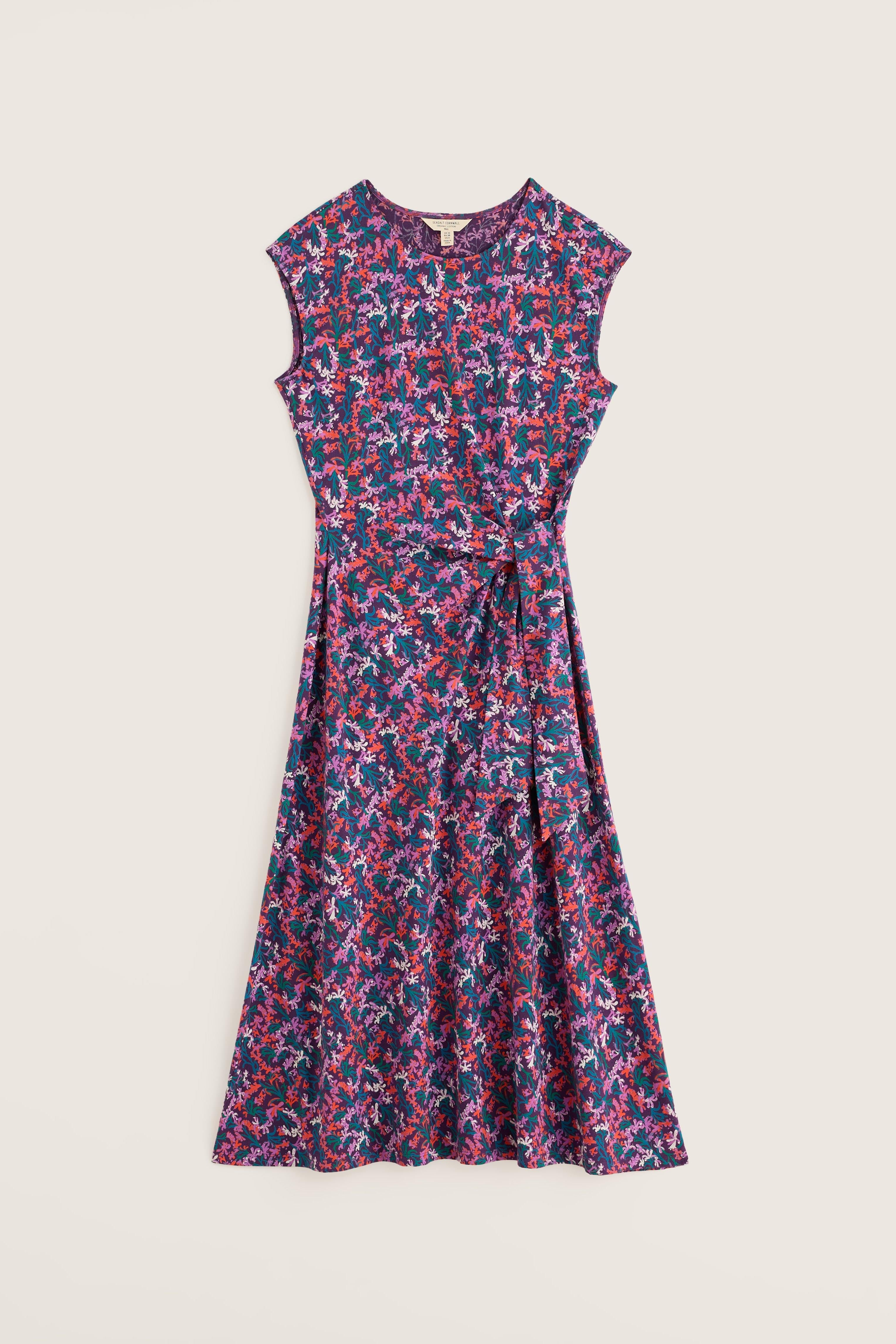 Floral patterned dress on a light beige background