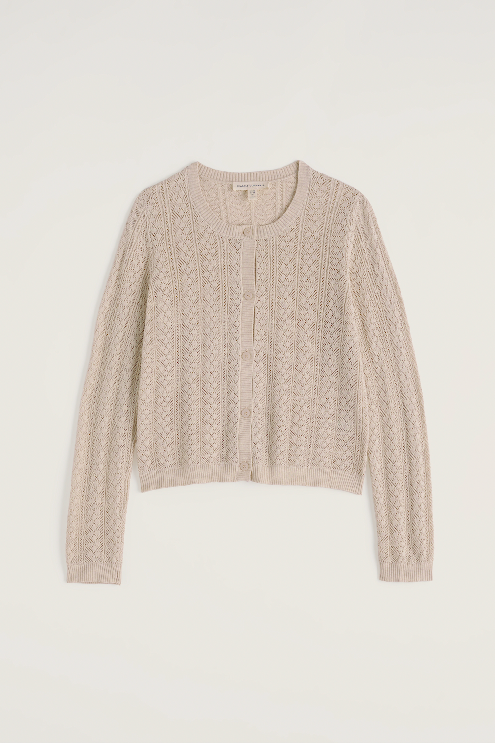 Beige Seasalt organic cotton knitted button-up cardigan on a plain background.