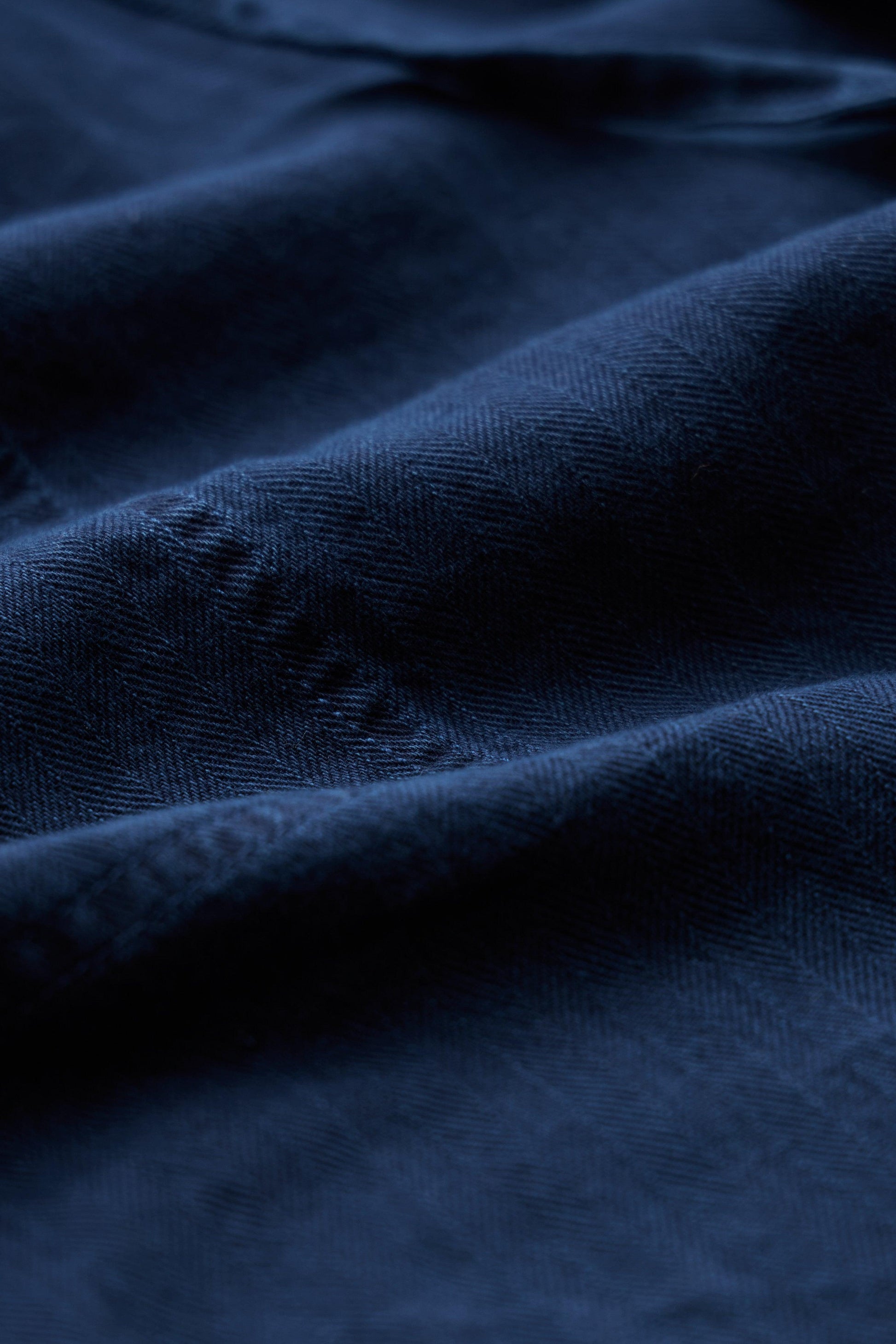 Close-up of dark blue fabric with visible texture