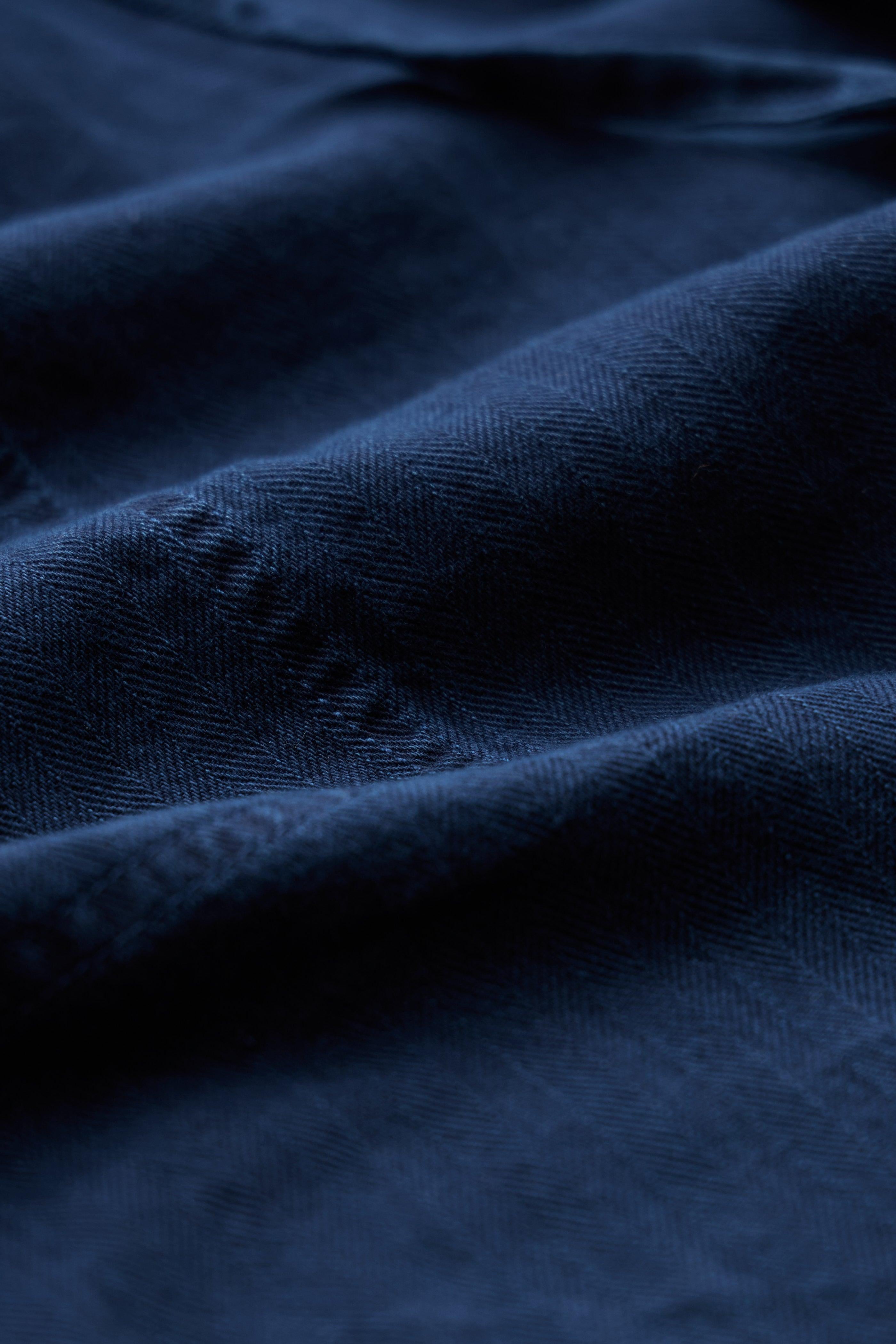 Close-up of dark blue fabric with visible texture