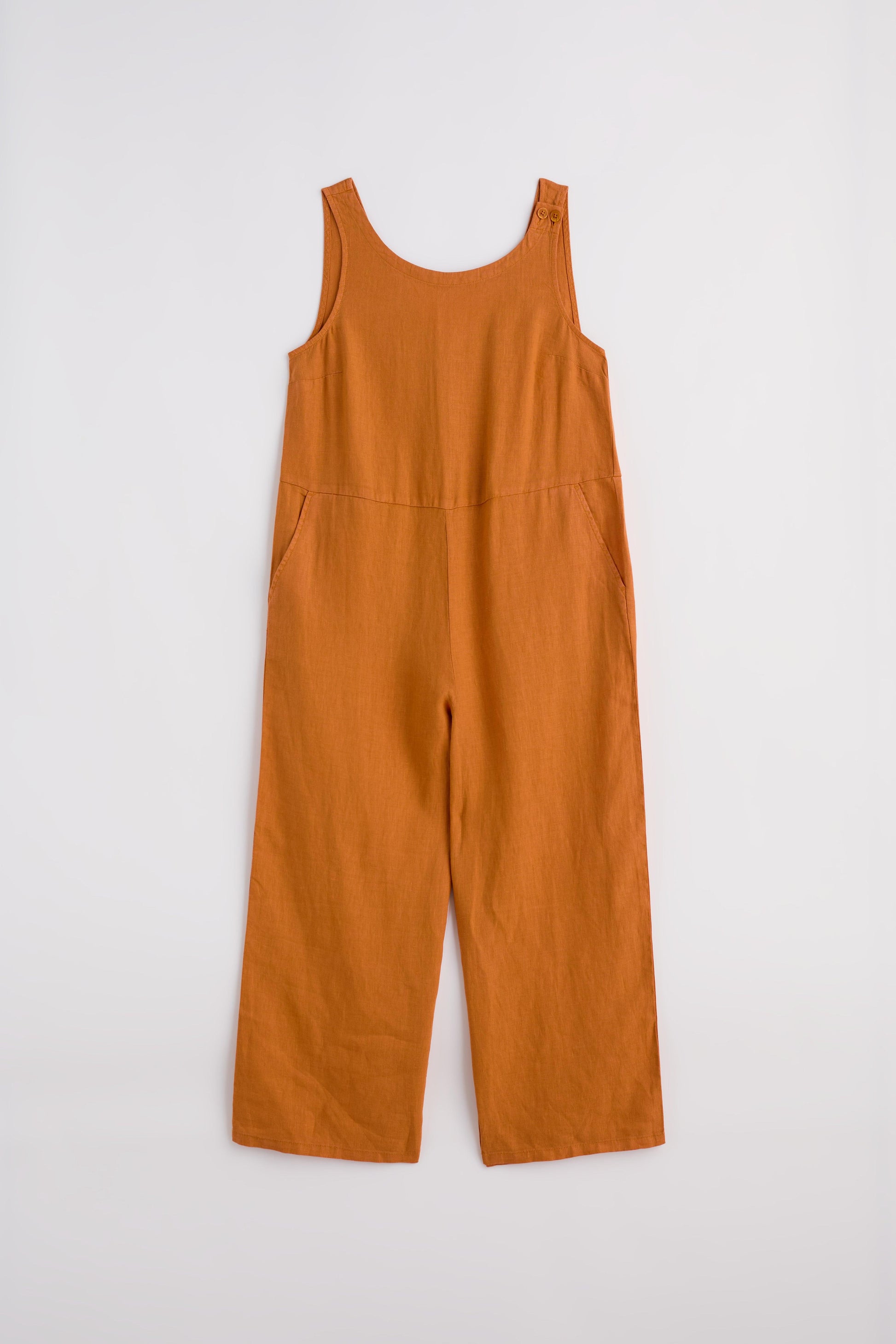 Rust orange sleeveless linen jumpsuit displayed against a plain white background.