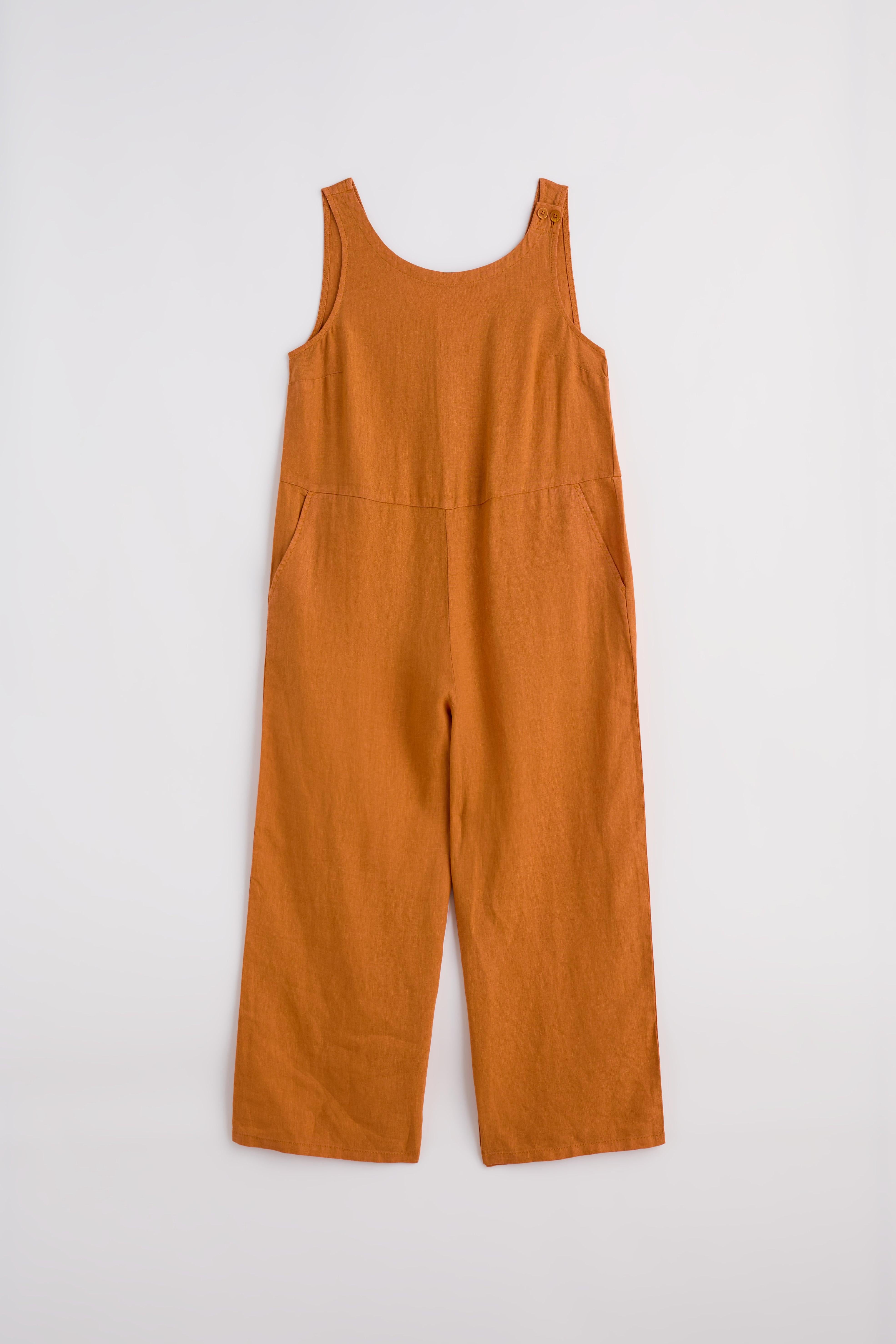 Rust orange sleeveless linen jumpsuit displayed against a plain white background.