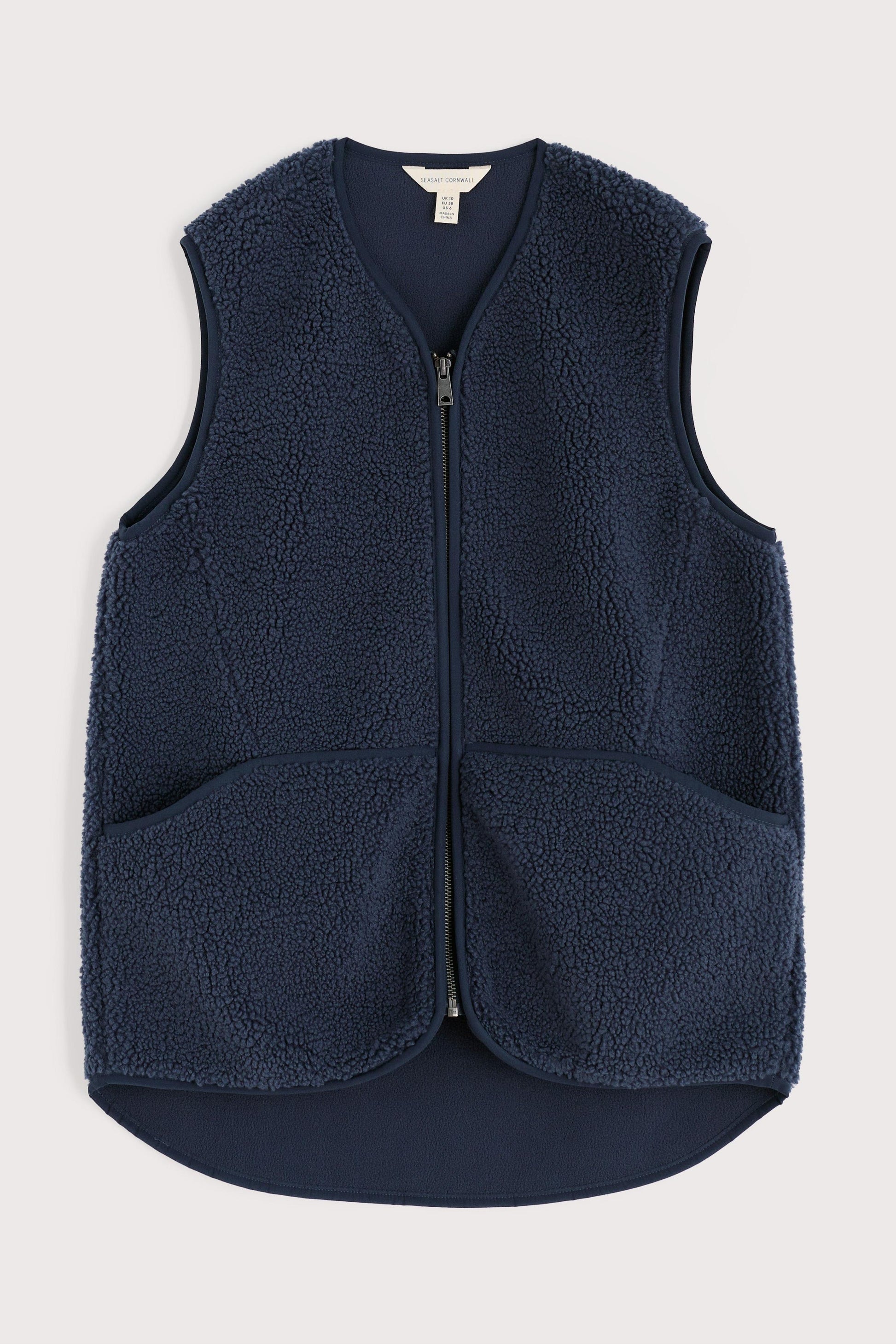 Navy blue fleece vest on a light gray background