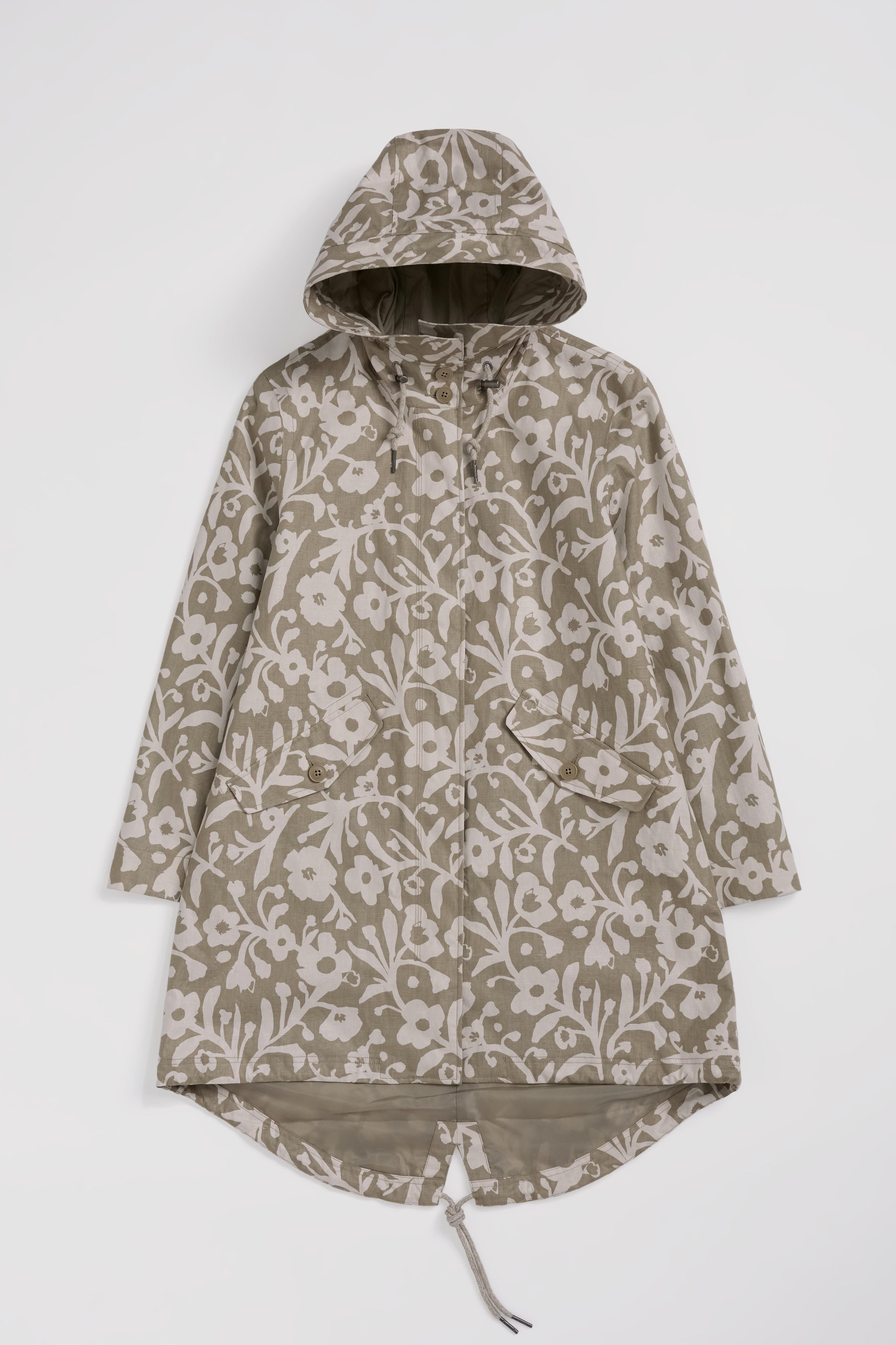 Floral-patterned raincoat on a white background