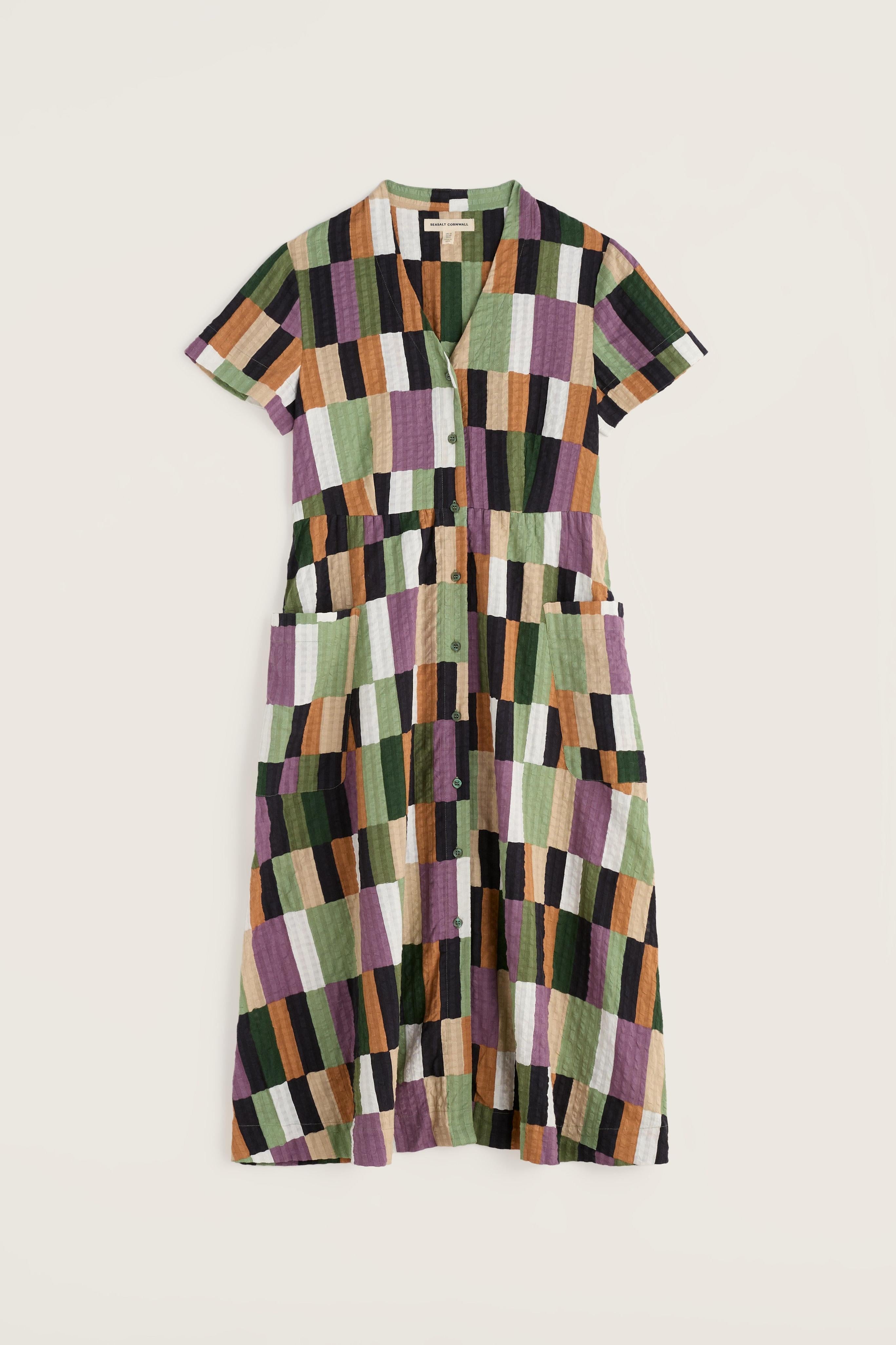 Multicoloured checkered dress on a light beige background