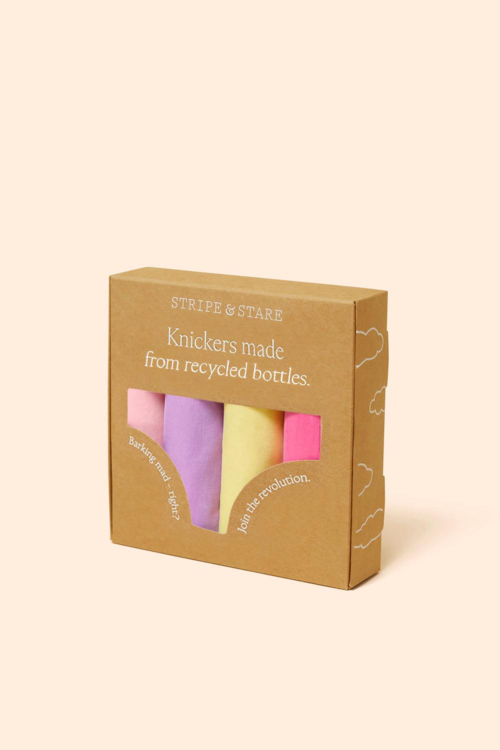 Box of pastel-colored knickers made from recycled bottles on a beige background