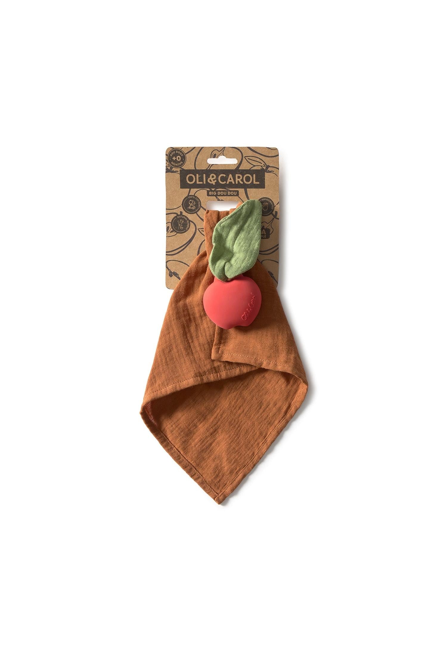 Baby doudou with red apple design and green leaf, branded 'Oli & Carol', on a white background.
