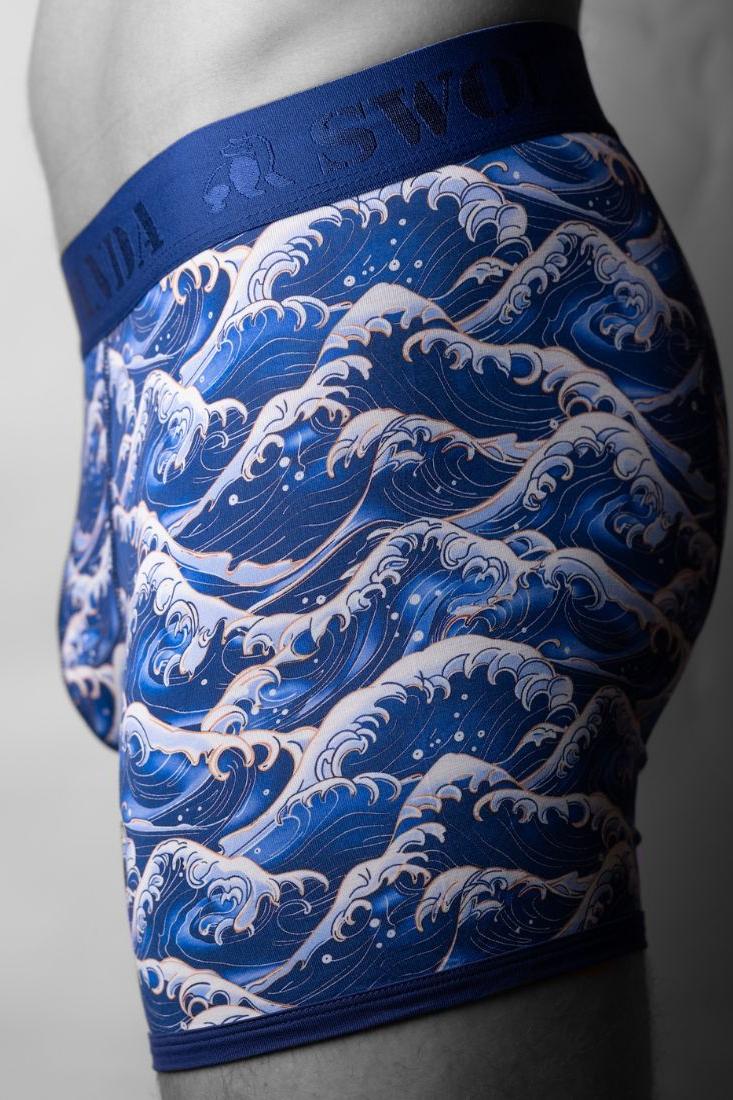 Close-up profile view of men's sustainable bamboo boxers featuring a Japanese-inspired blue sea wave pattern.