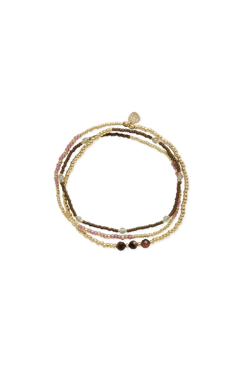 Set of three beaded bracelets on a white background