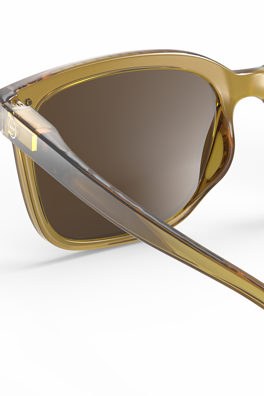 Close-up of translucent amber acetate sunglasses frames against a plain white background.