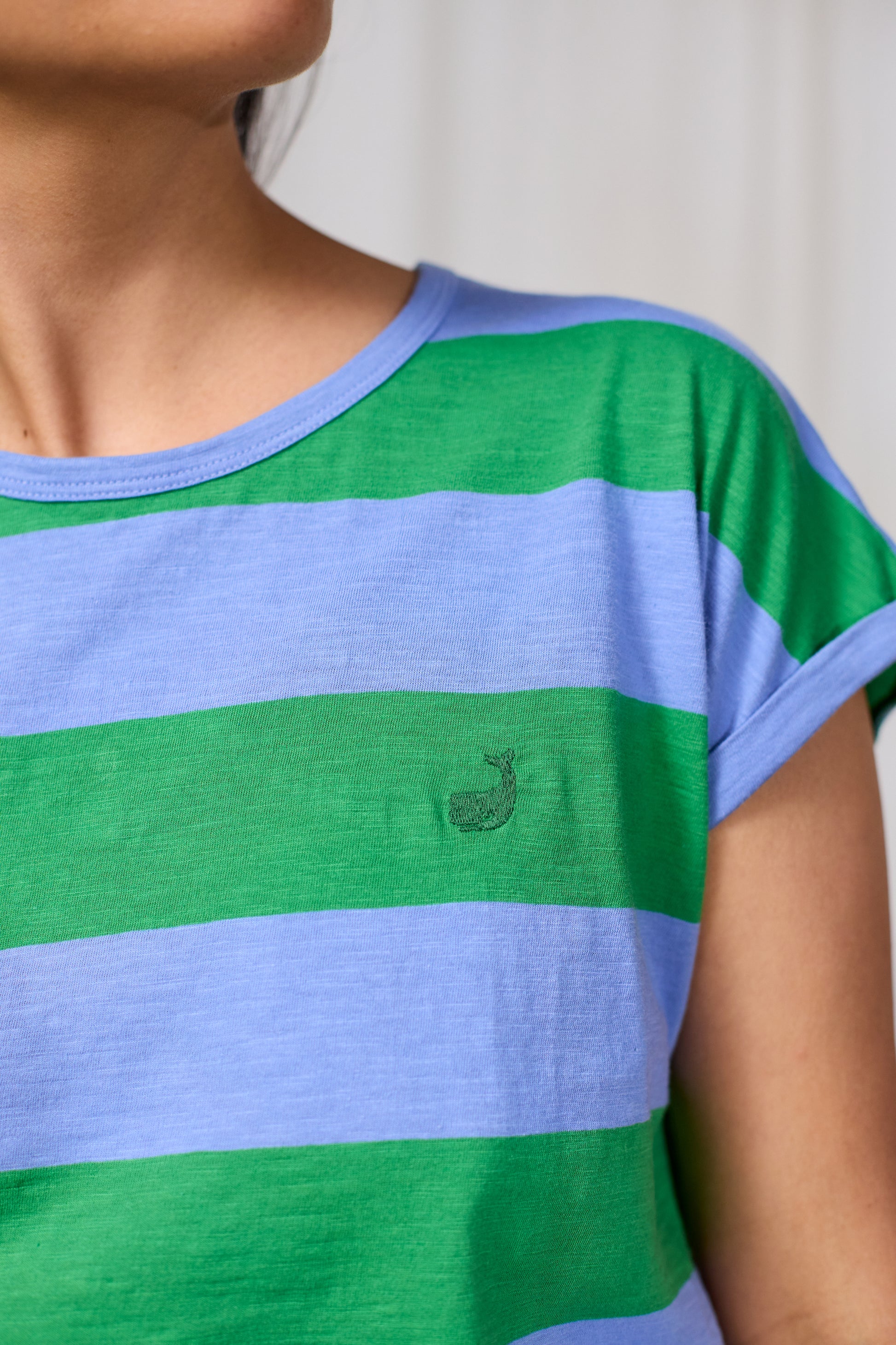Green and blue striped TWOTHIRDS shirt with a small logo on a plain background