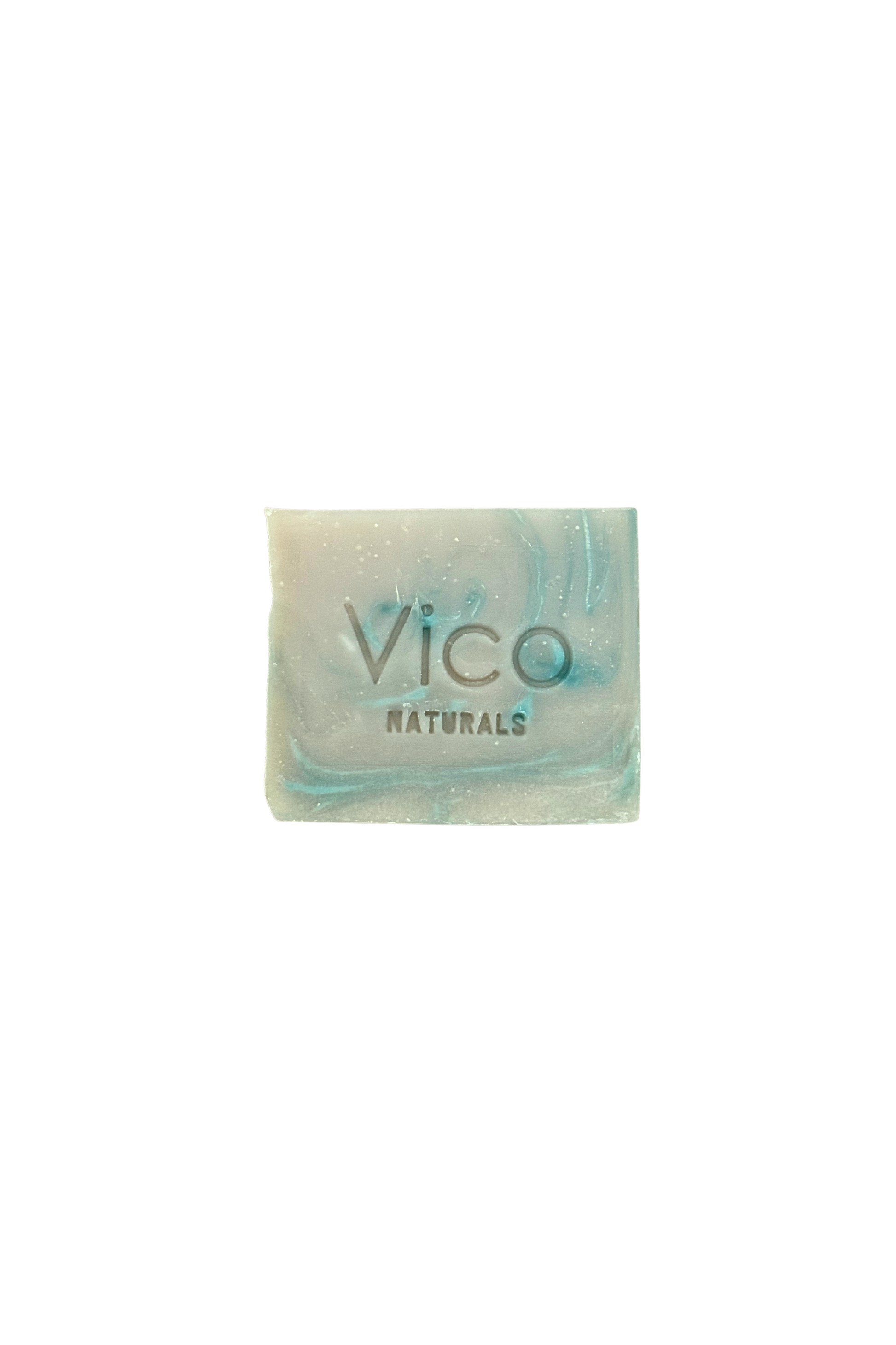 A square bar of Vico Naturals soap with blue and grey marbled swirls, isolated on a white background.