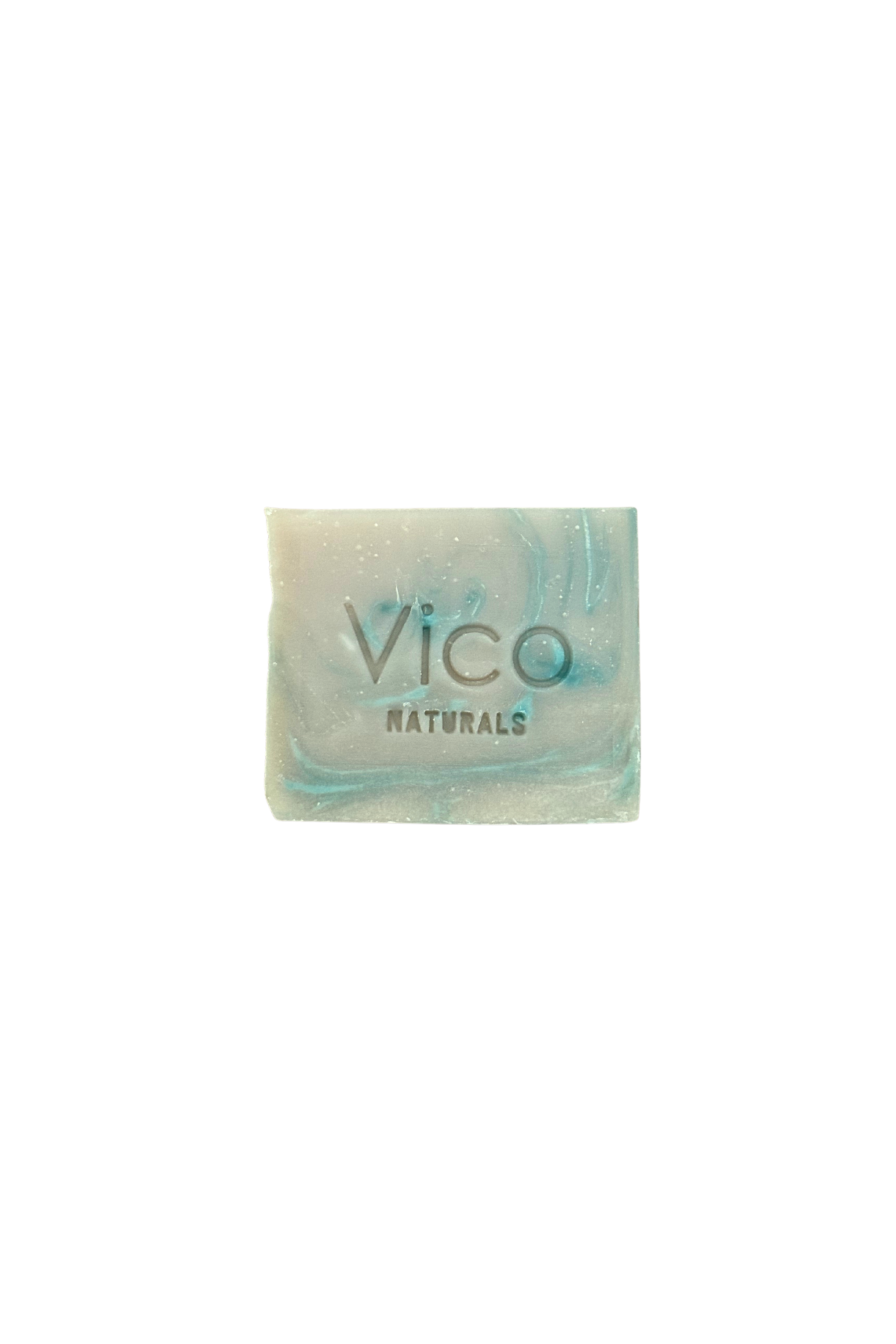A square bar of Vico Naturals soap with blue and grey marbled swirls, isolated on a white background.