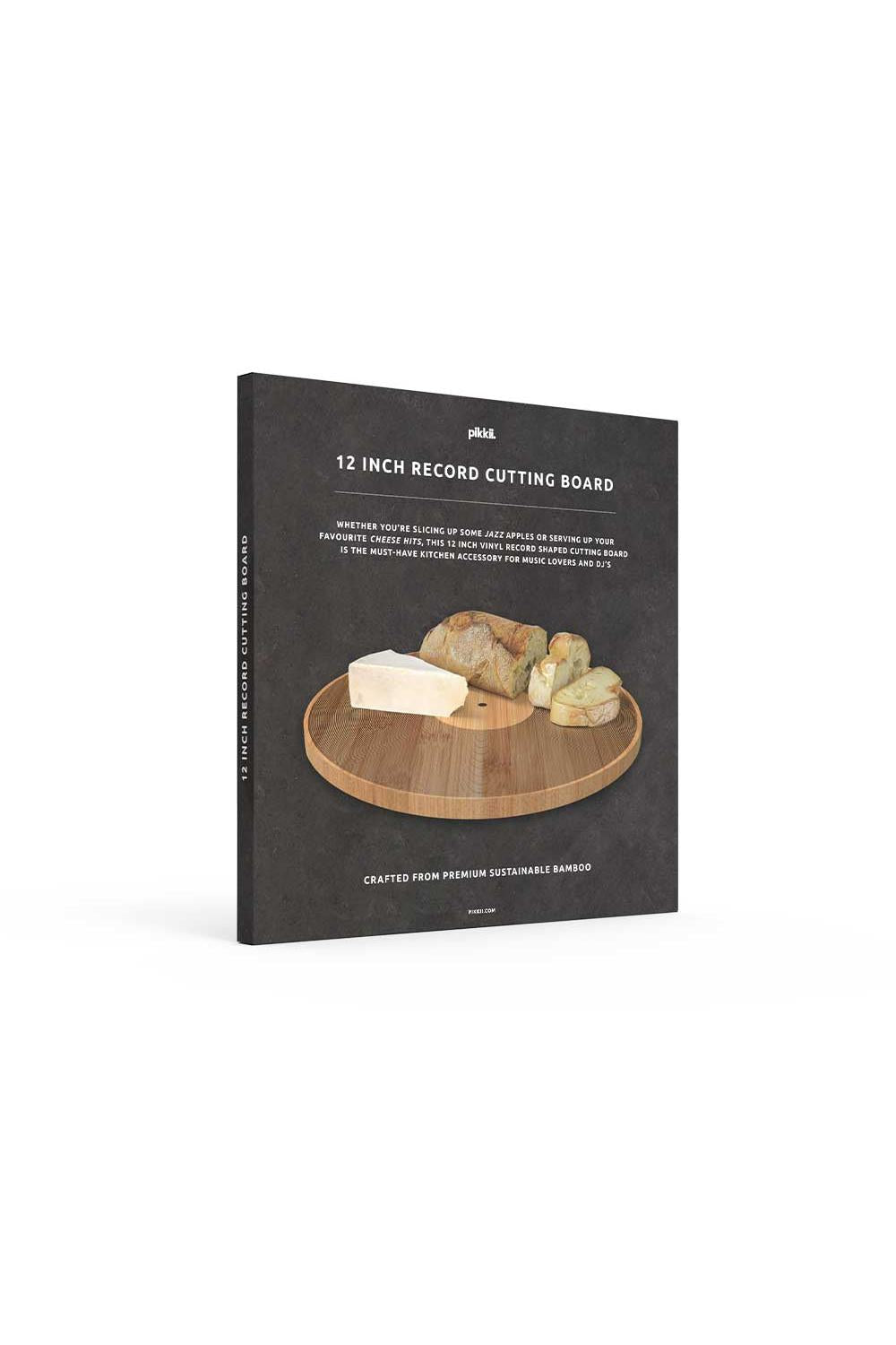 A rectangular record cutting board shown standing upright on a white background. The board has a dark charcoal/black textured cover with white text reading '12 INCH RECORD CUTTING BOARD' and a central photo of a round wooden board holding cheese and bread.