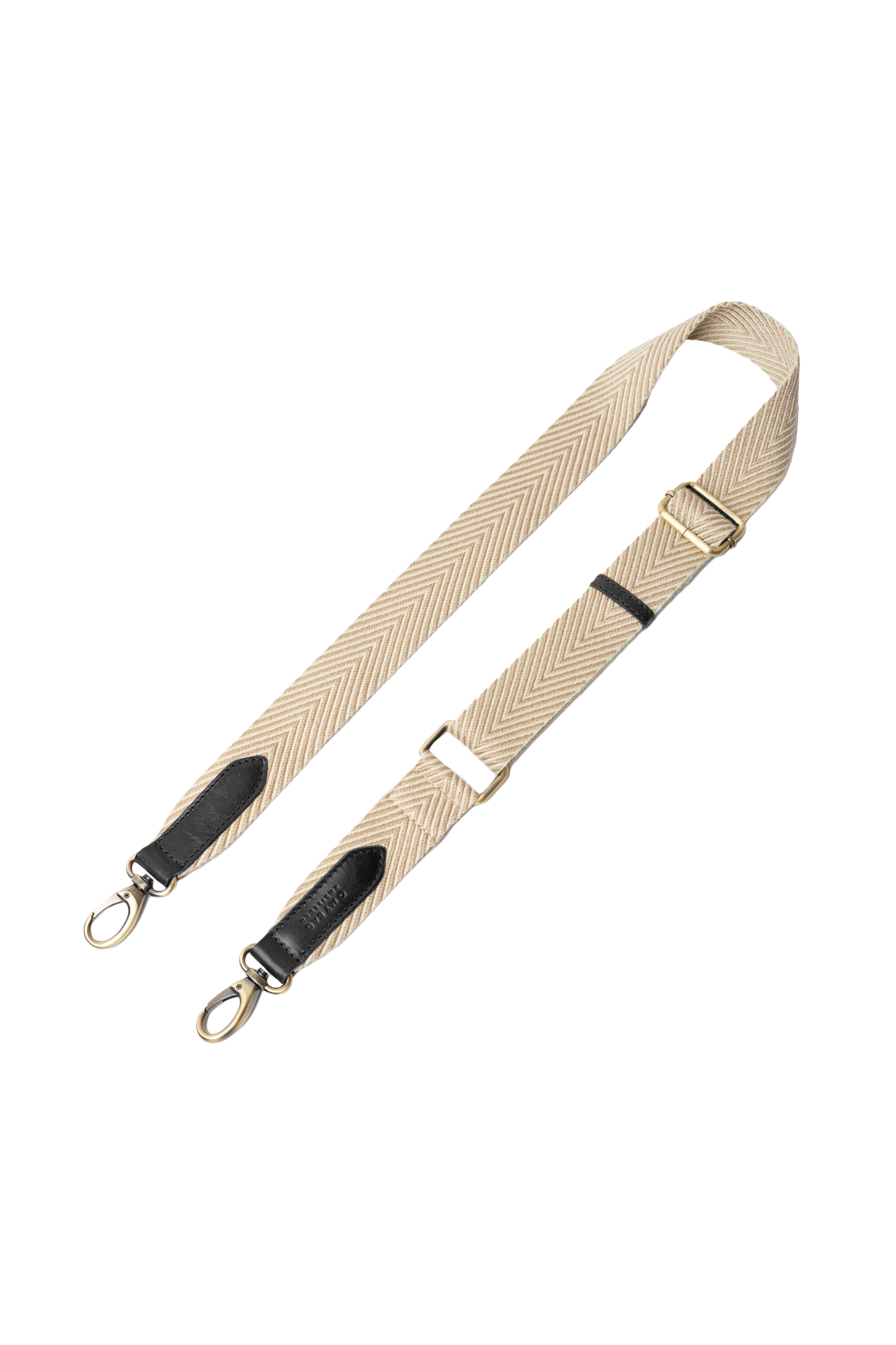 Beige bag strap with black accents on a white background