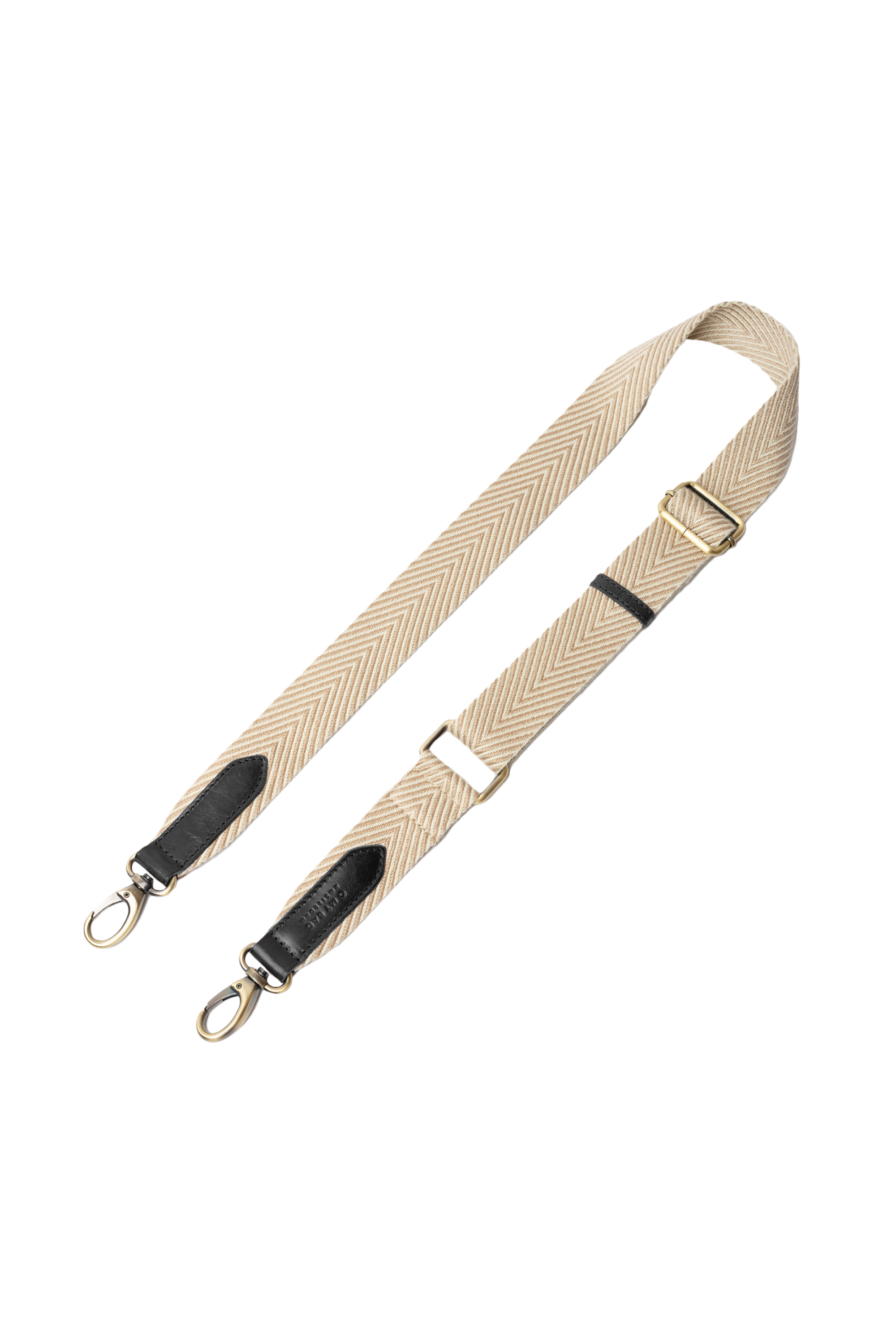 Beige bag strap with black accents on a white background