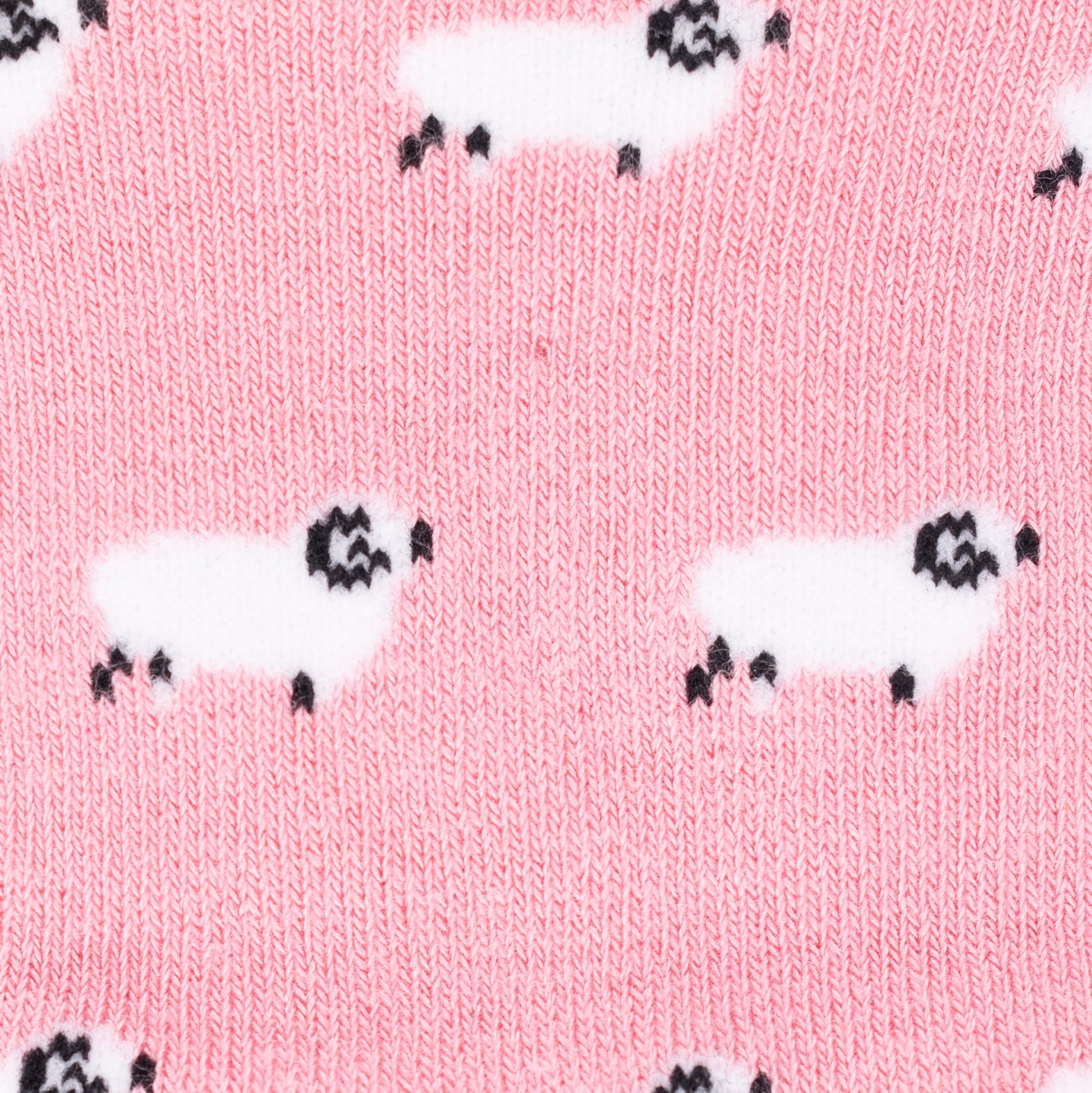 a close up of a sheep design on a pair of pink bamboo socks