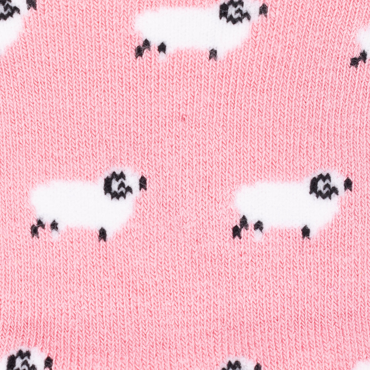 a close up of a sheep design on a pair of pink bamboo socks