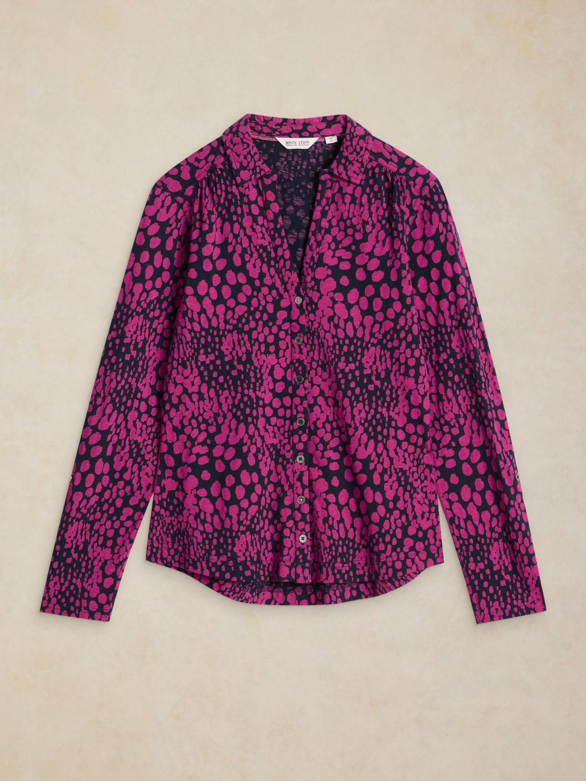 White Stuff Annie jersey blouse with pink animal print pattern on a dark background.