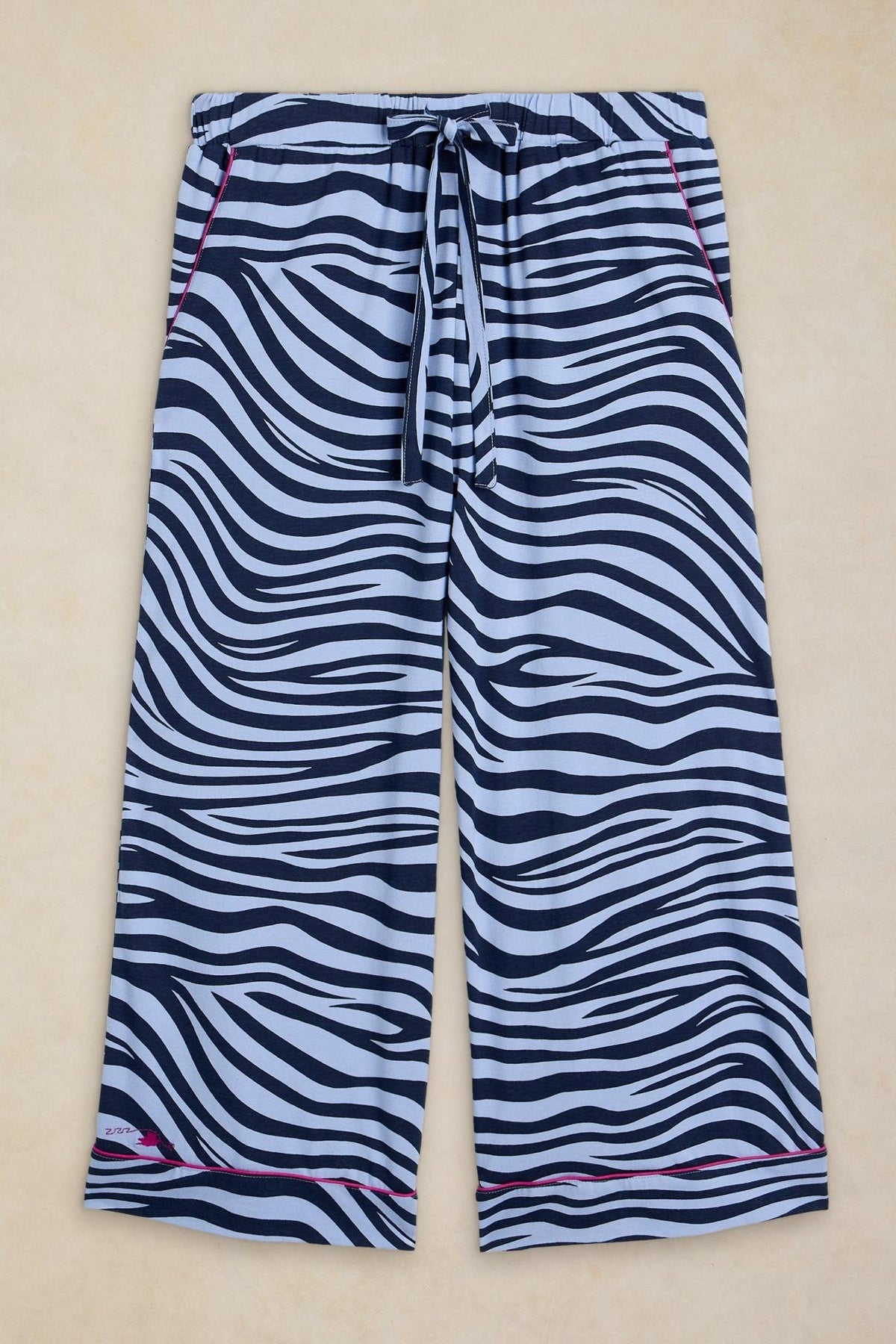 White Stuff blue pyjama bottoms featuring an animal print pattern, elastic drawstring waist, and cotton blend fabric.