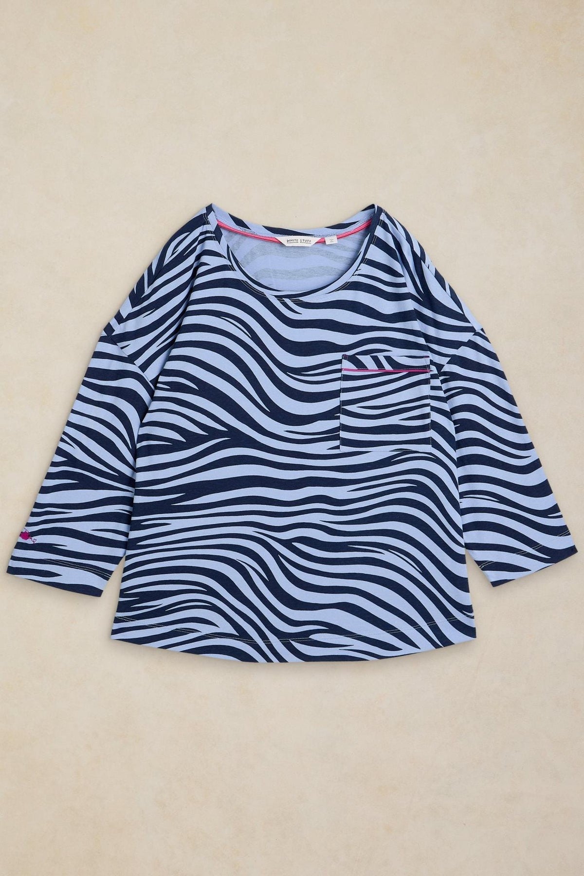 A long-sleeved blue pyjama top by White Stuff featuring a zebra animal print pattern and a chest pocket.