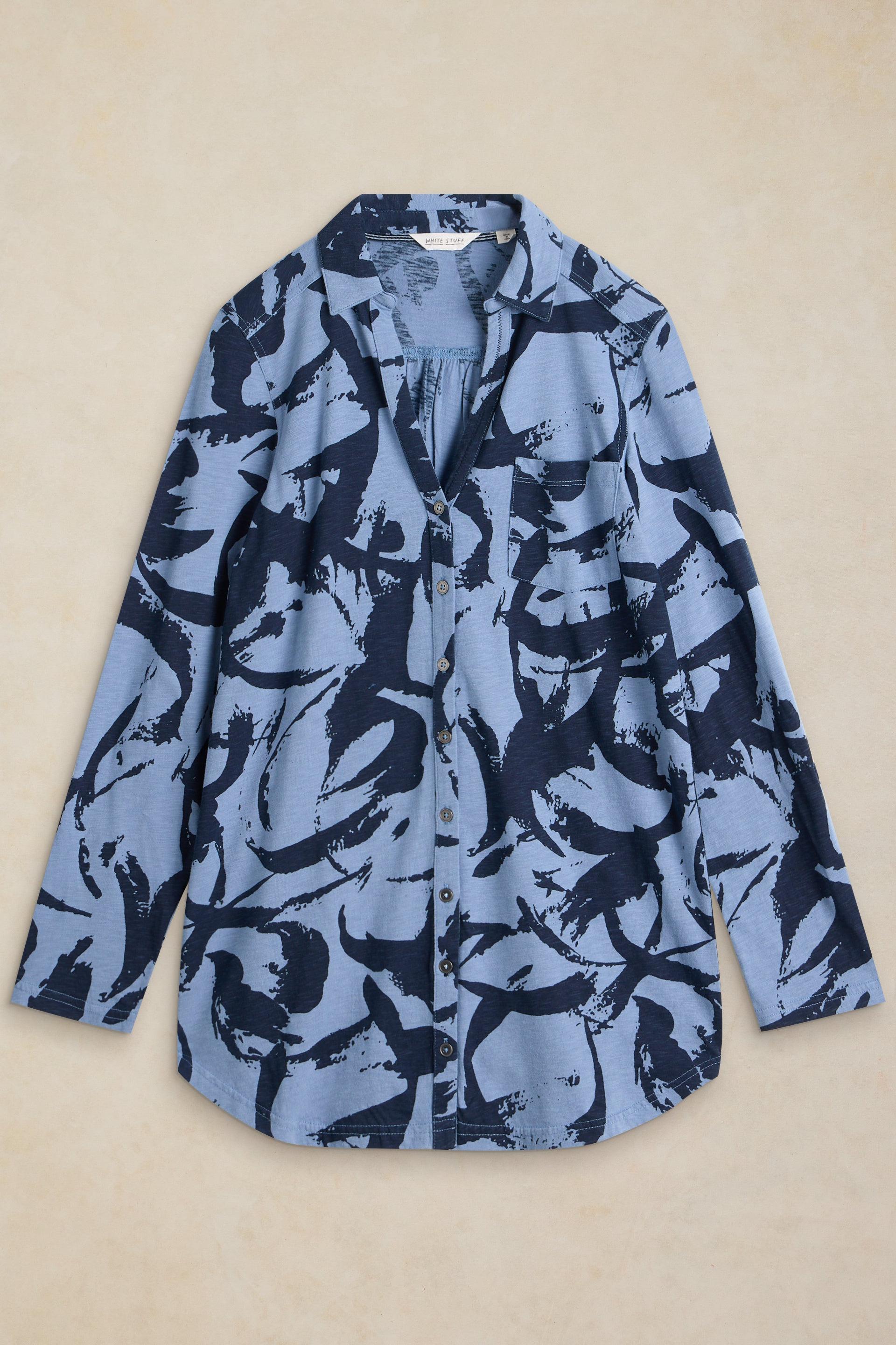 Women's blue button-down shirt from White Stuff featuring an abstract dark blue print on soft cotton fabric