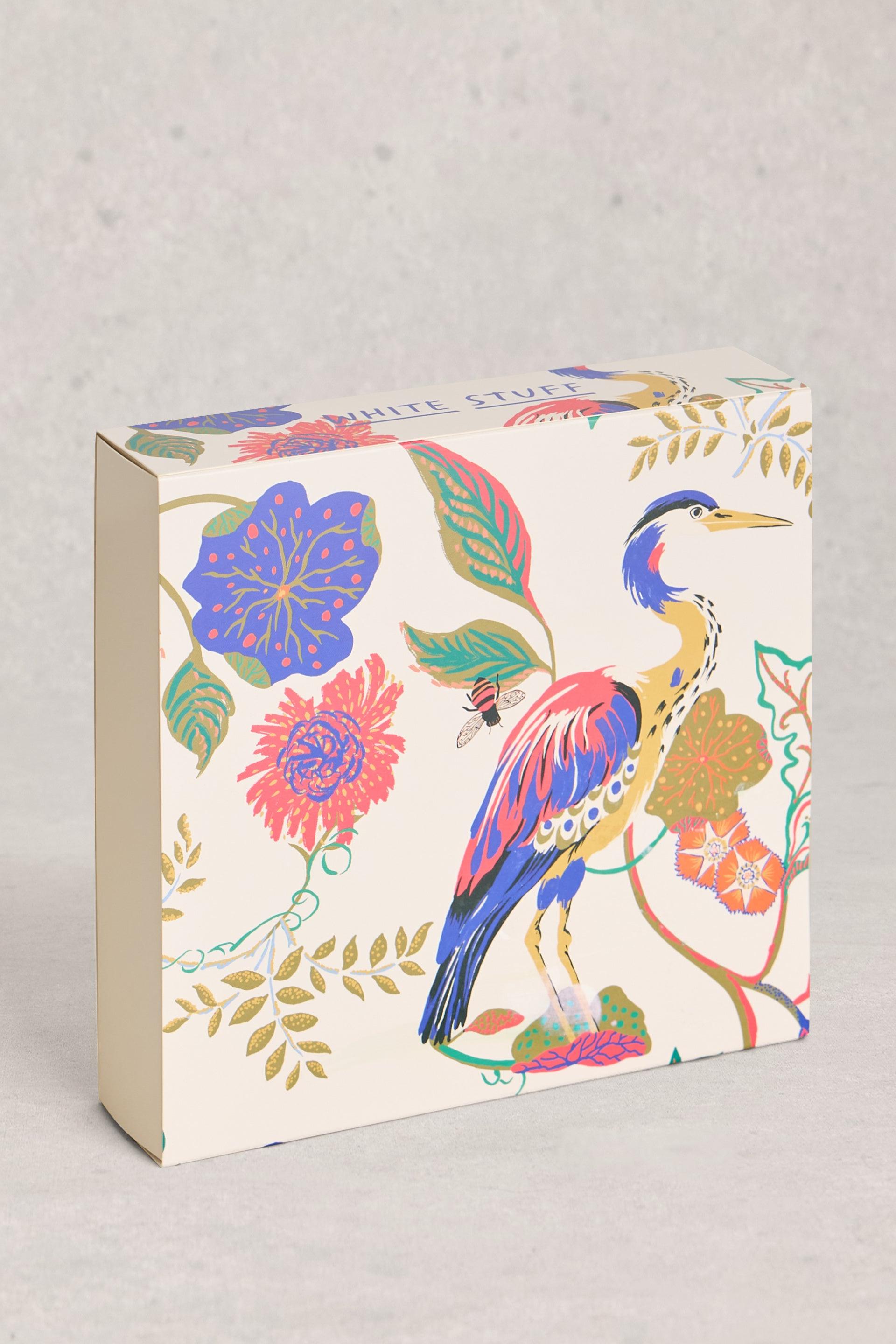 White Stuff branded gift box featuring a colorful heron and floral botanical print.