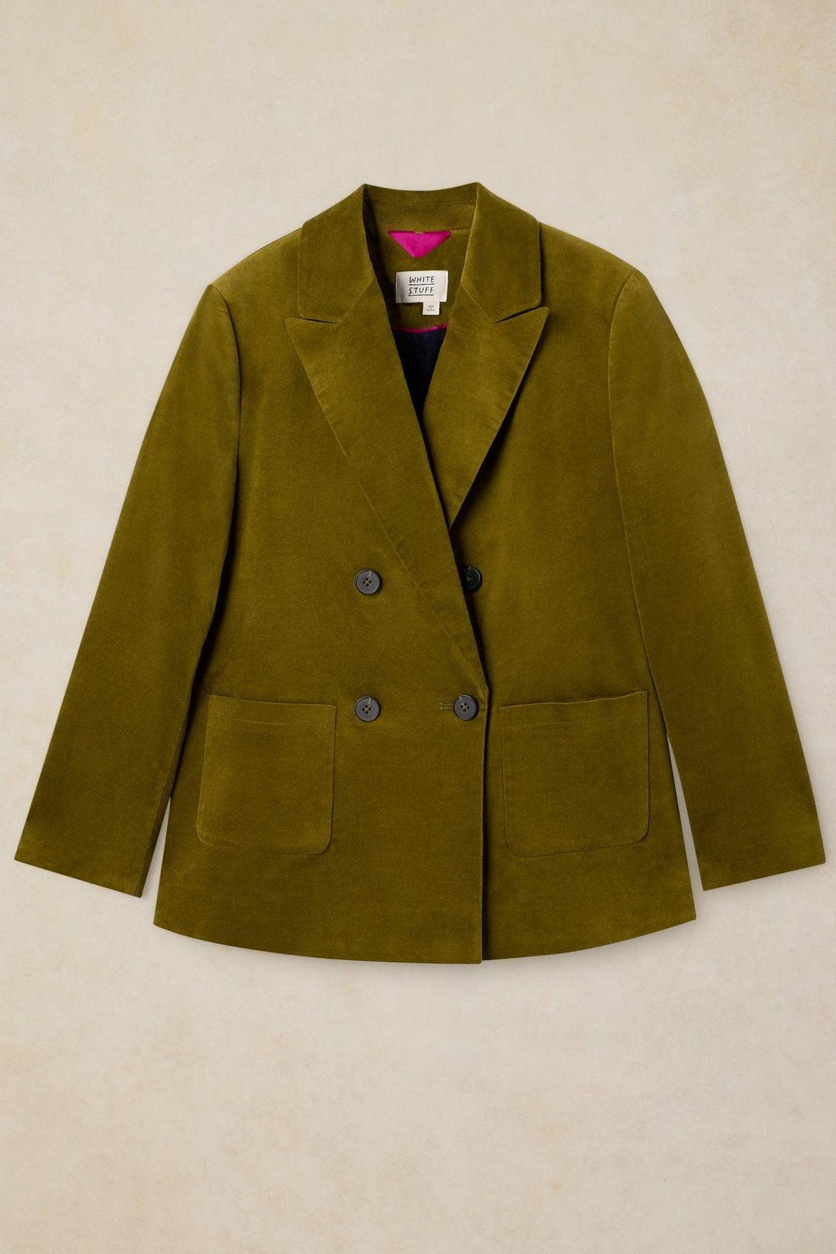 White Stuff green velvet double-breasted blazer with patch pockets against a neutral background.