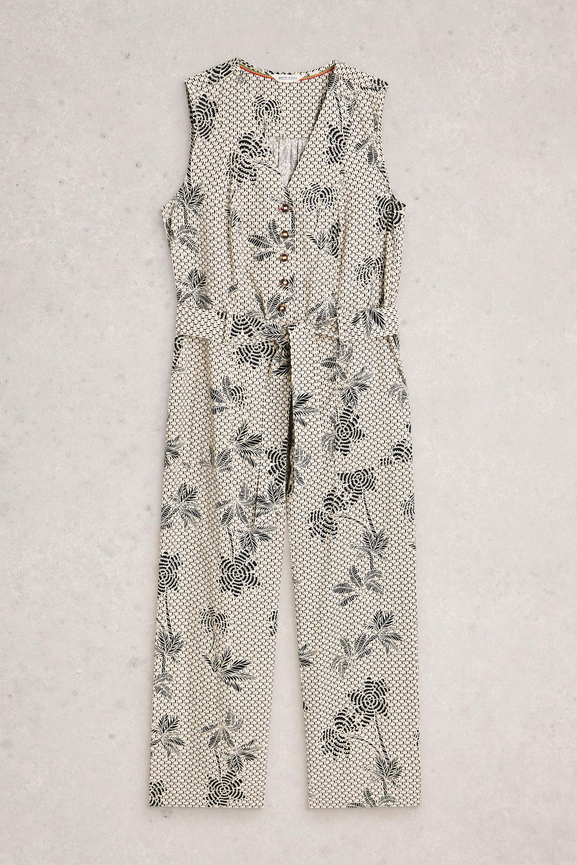 Floral patterned linen jumpsuit on a light gray background