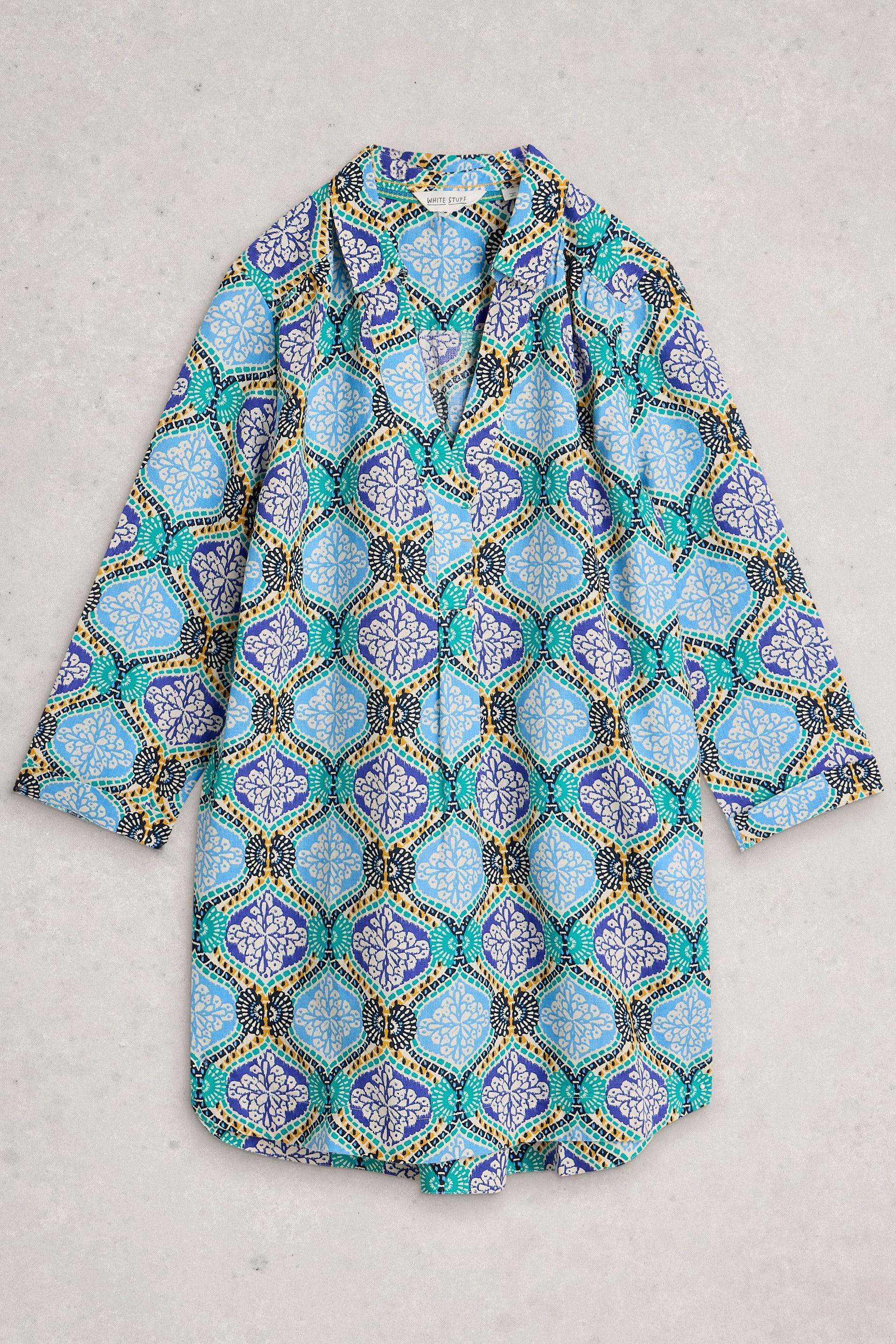 Colorful patterned tunic on a light gray background