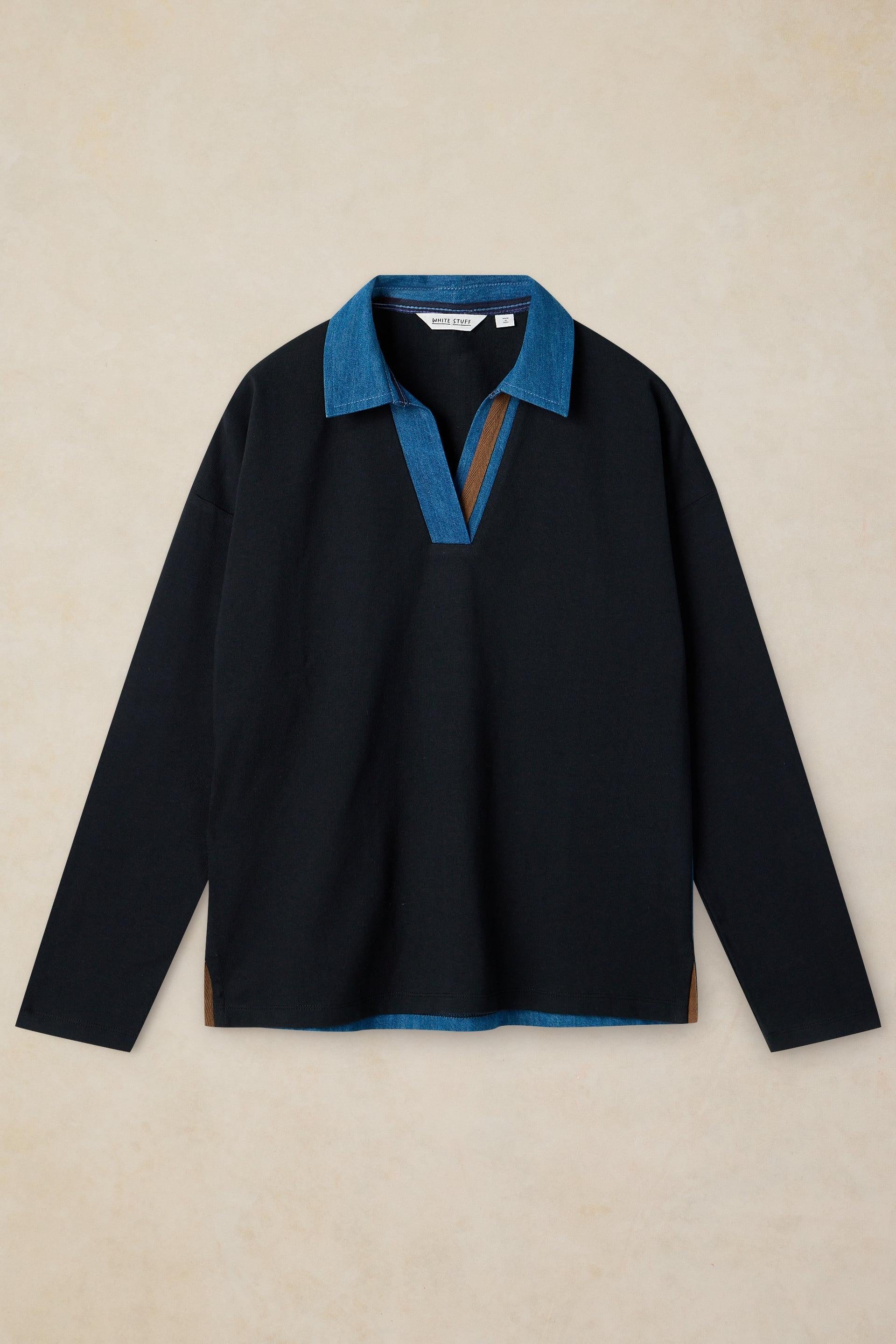 A long-sleeved black polo shirt with a denim collar from White Stuff made of organic cotton