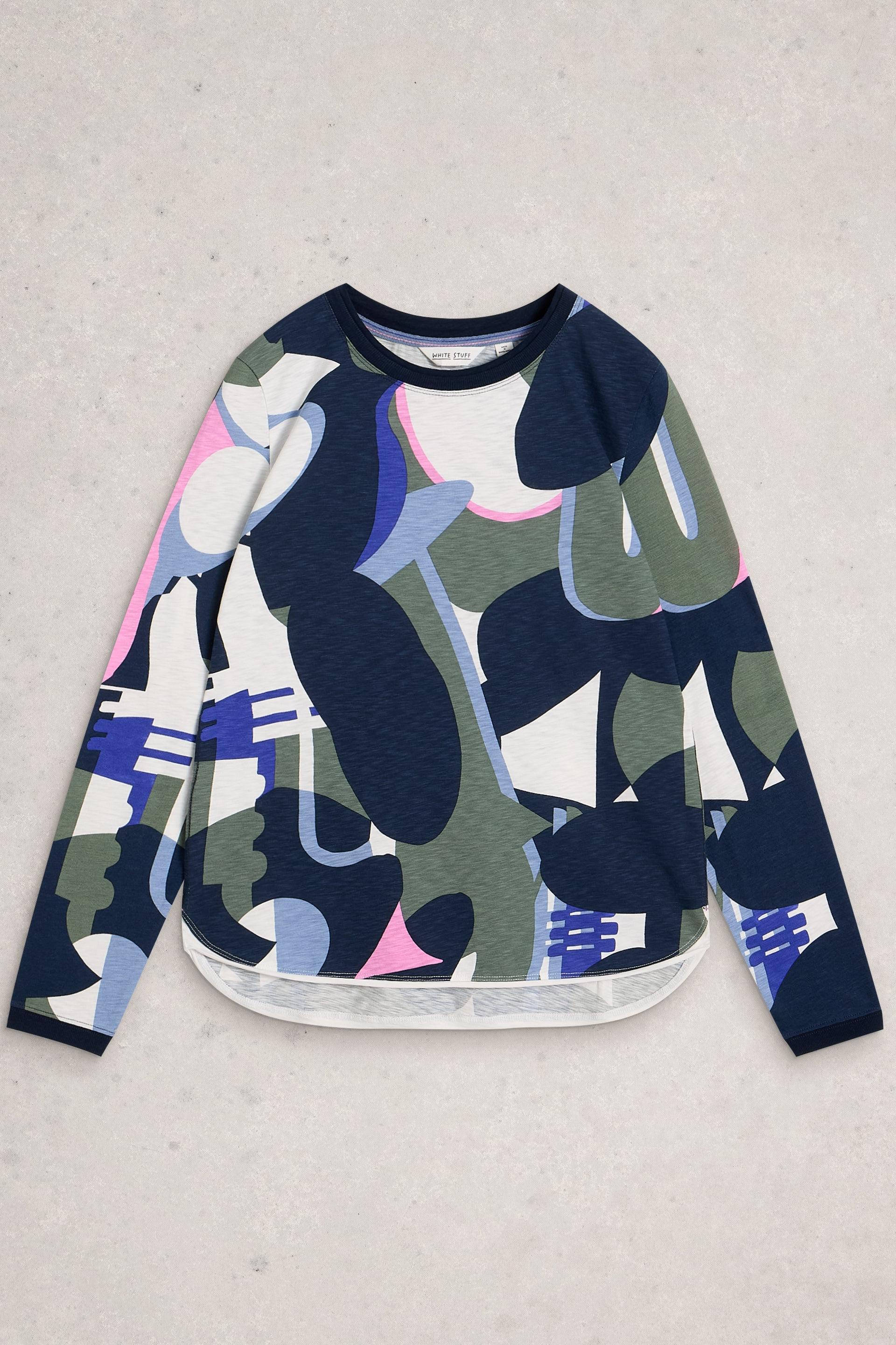A White Stuff long-sleeved top with a colorful abstract geometric print, laid flat against a neutral grey background.
