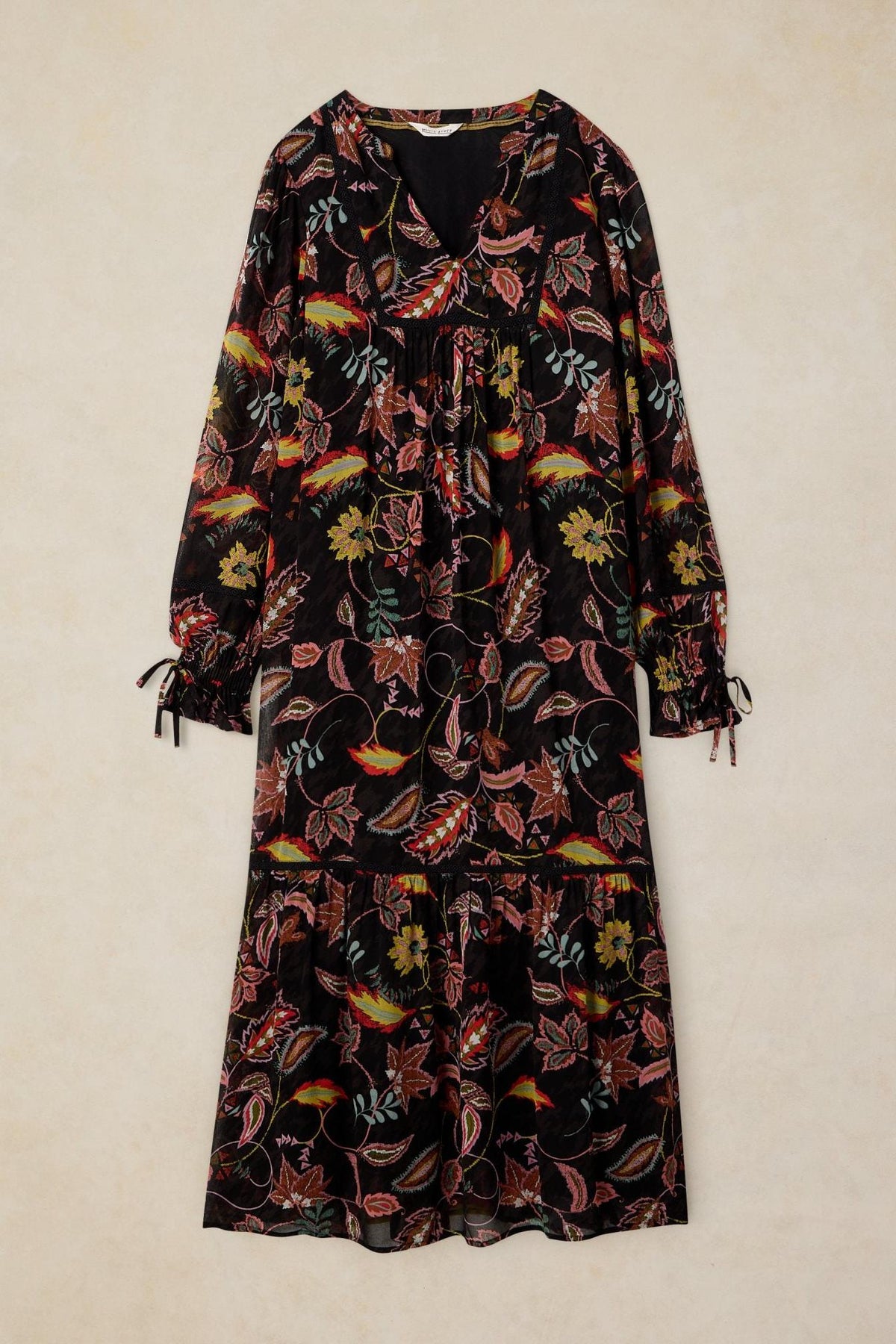 White Stuff long dress in black viscose with a colorful floral and paisley print pattern.