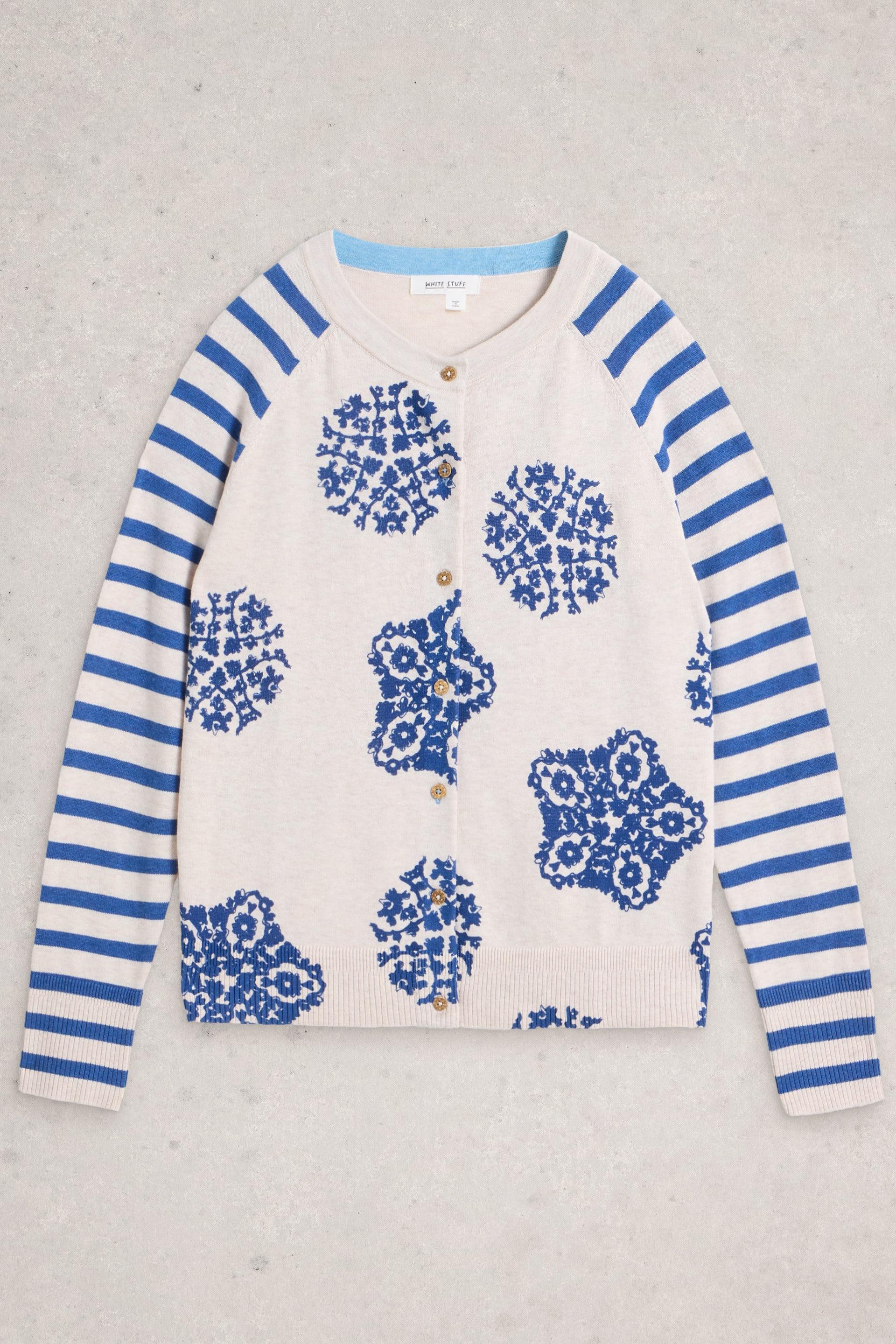 White Stuff cardigan with blue floral pattern and striped sleeves on a light gray background