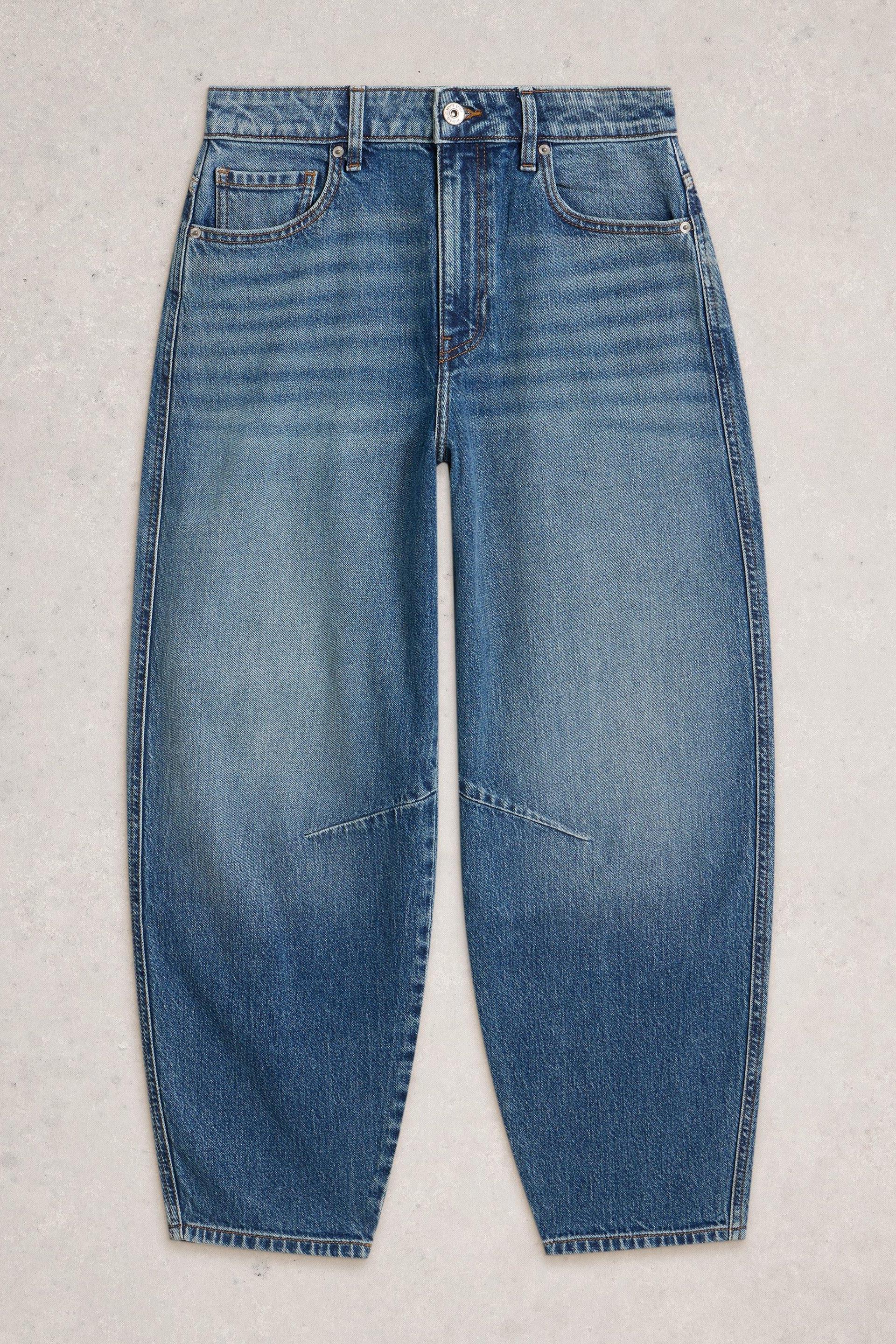 White Stuff mid-denim barrel leg jeans for women on a grey background.