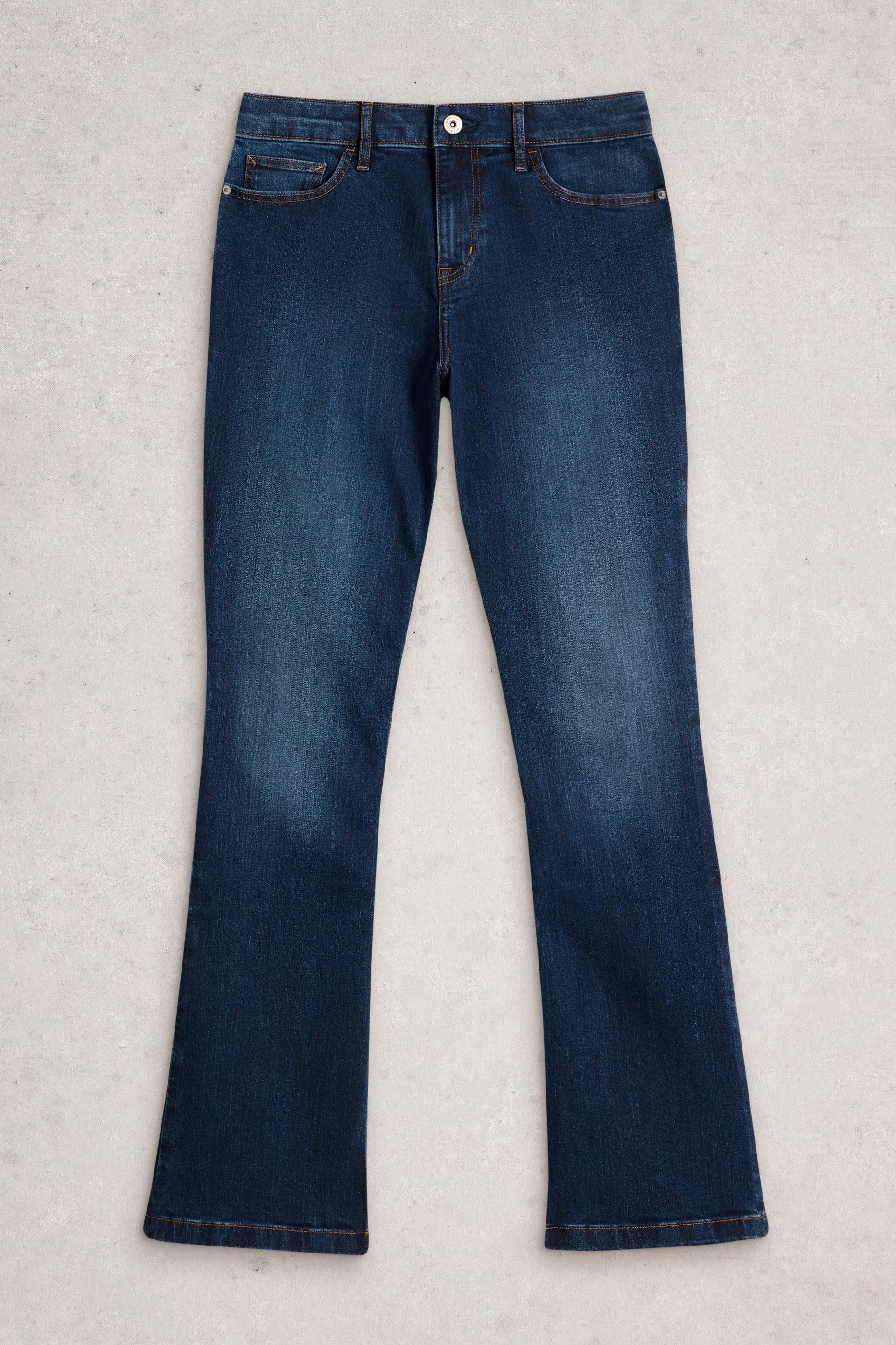 Dark blue White Stuff organic cotton bootcut jeans on a neutral background.