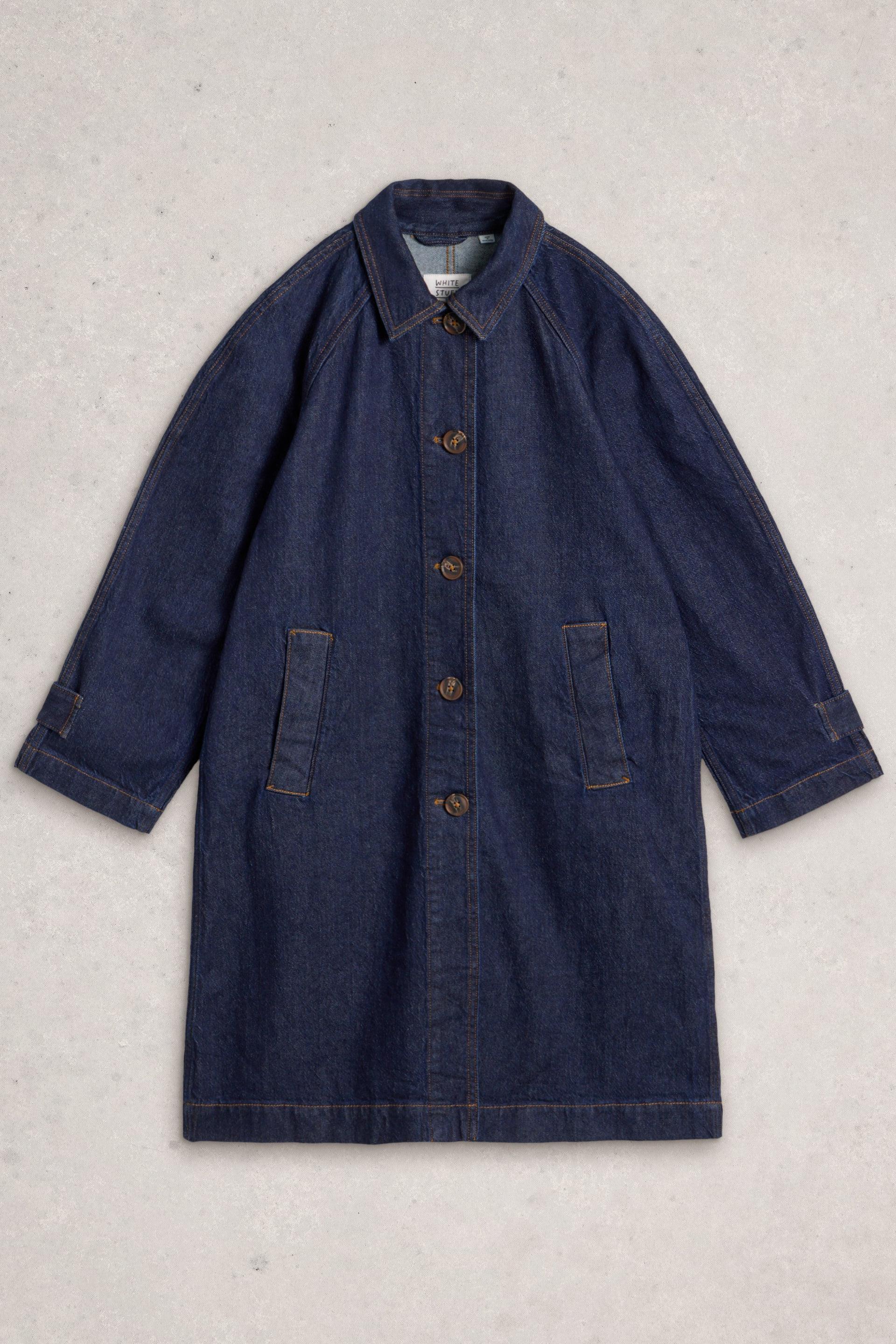A White Stuff organic cotton long dark blue denim coat laid flat on a neutral background
