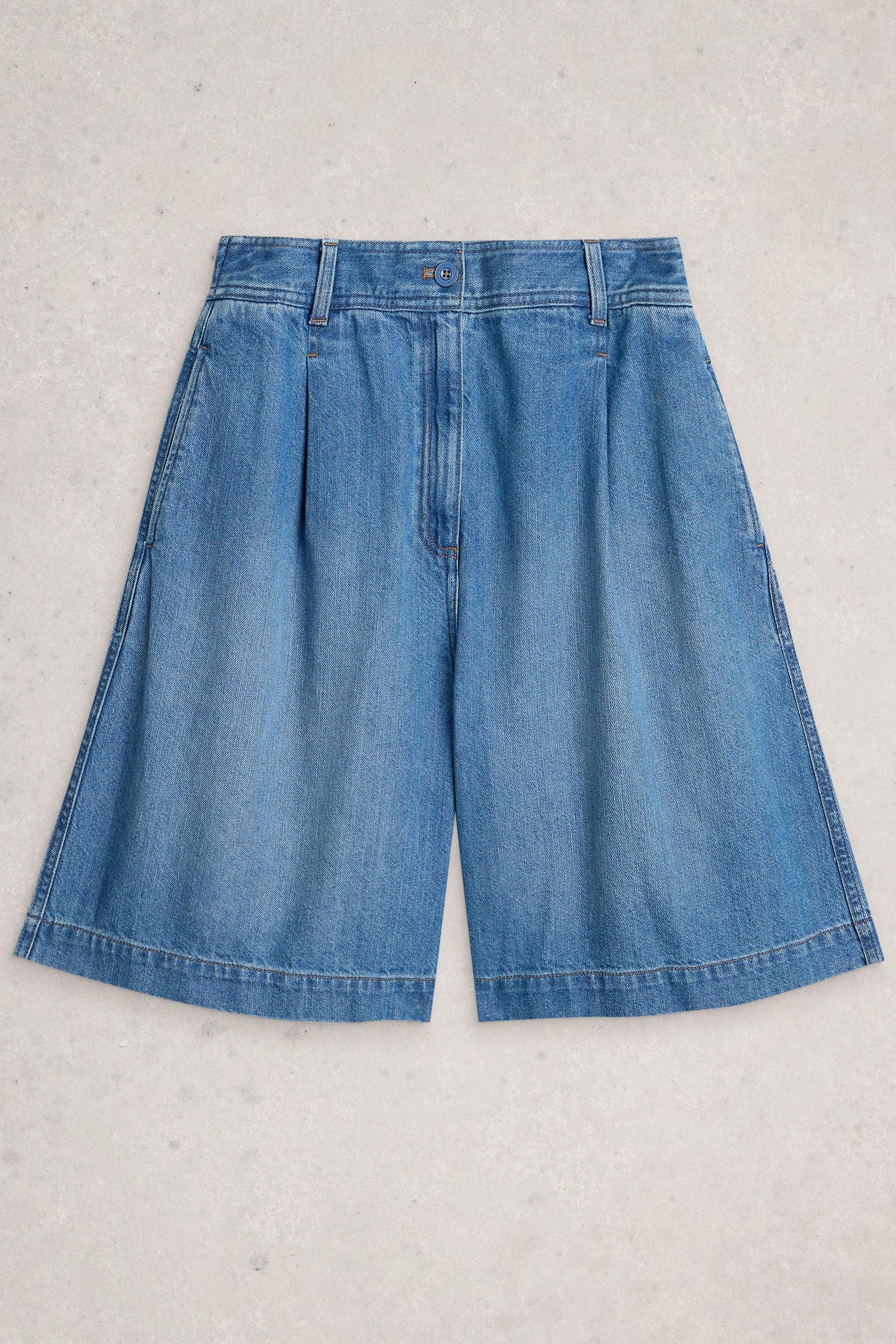 Blue denim organic cotton shorts on a light gray background