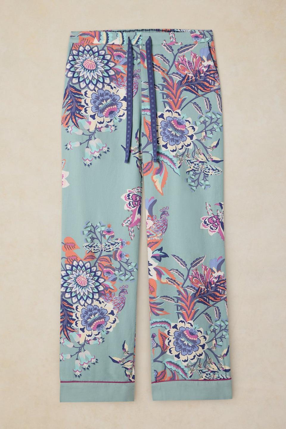 White Stuff floral print organic cotton pyjama bottoms with a drawstring waist against a neutral background.