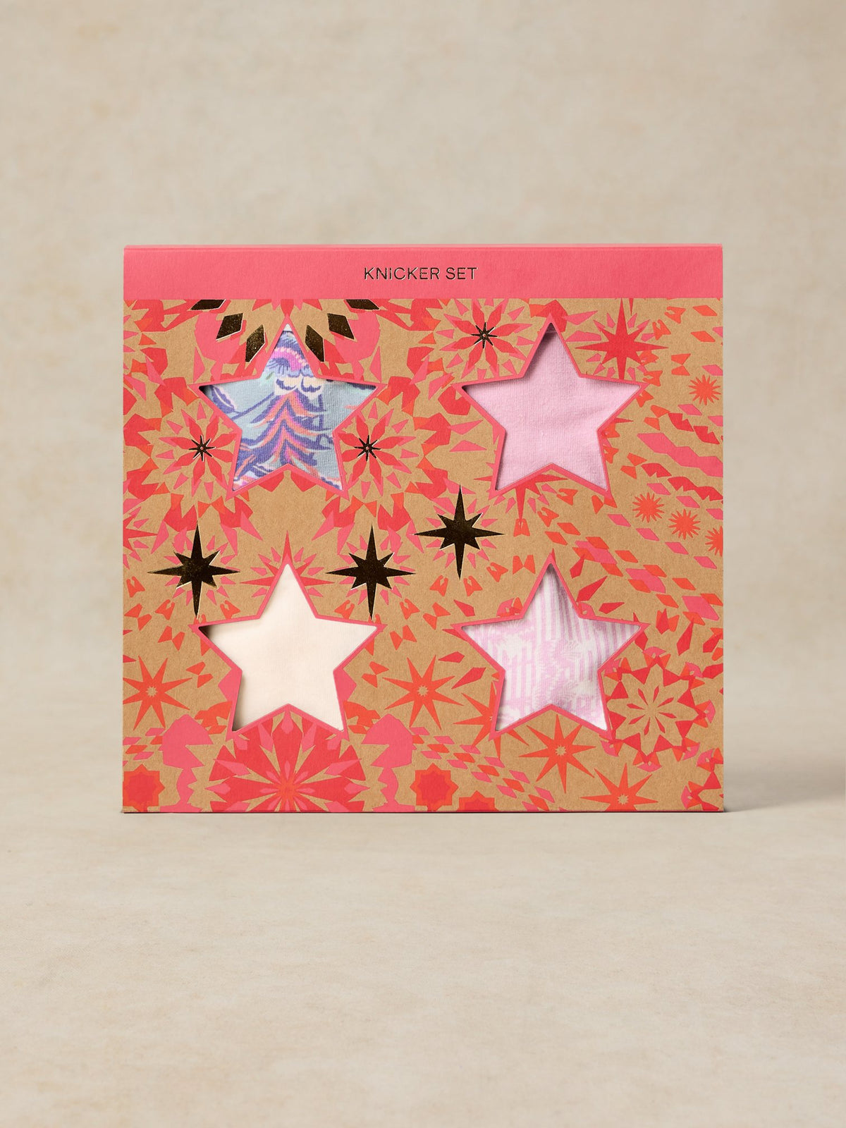 White Stuff multi pack gift box featuring organic cotton women's underwear visible through star-shaped cutouts.