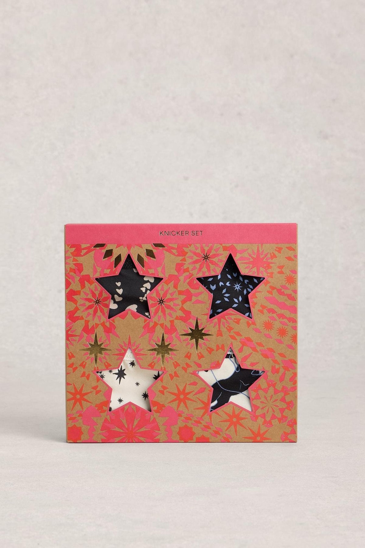 White Stuff multi pack organic cotton women's knickers in a festive star-patterned gift box.