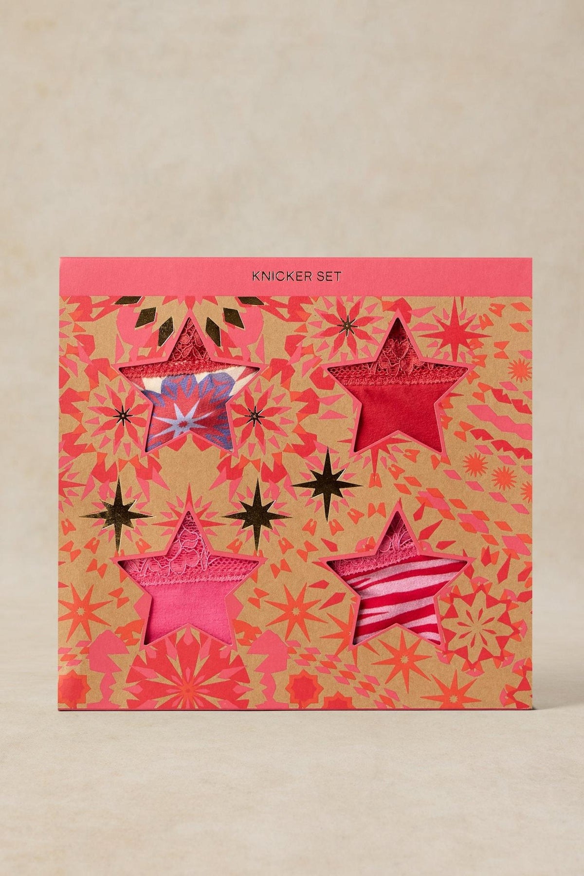 A White Stuff organic cotton women's underwear multi pack gift box featuring four patterned knickers in star cutouts.