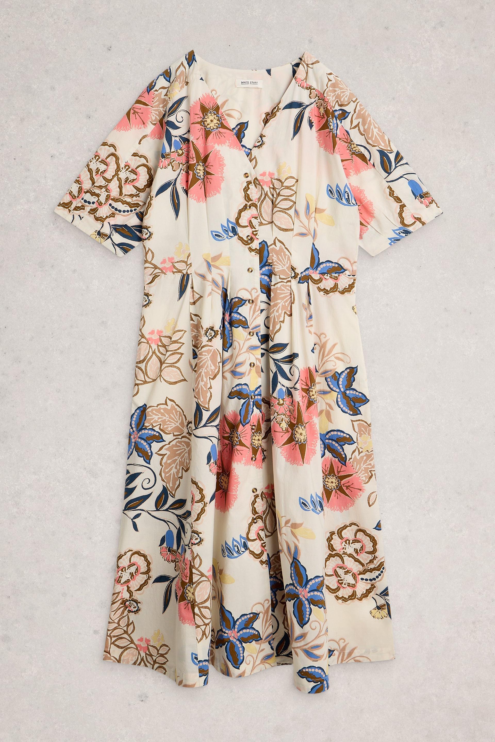 Floral organic cotton dress with a pattern of flowers and leaves on a light background