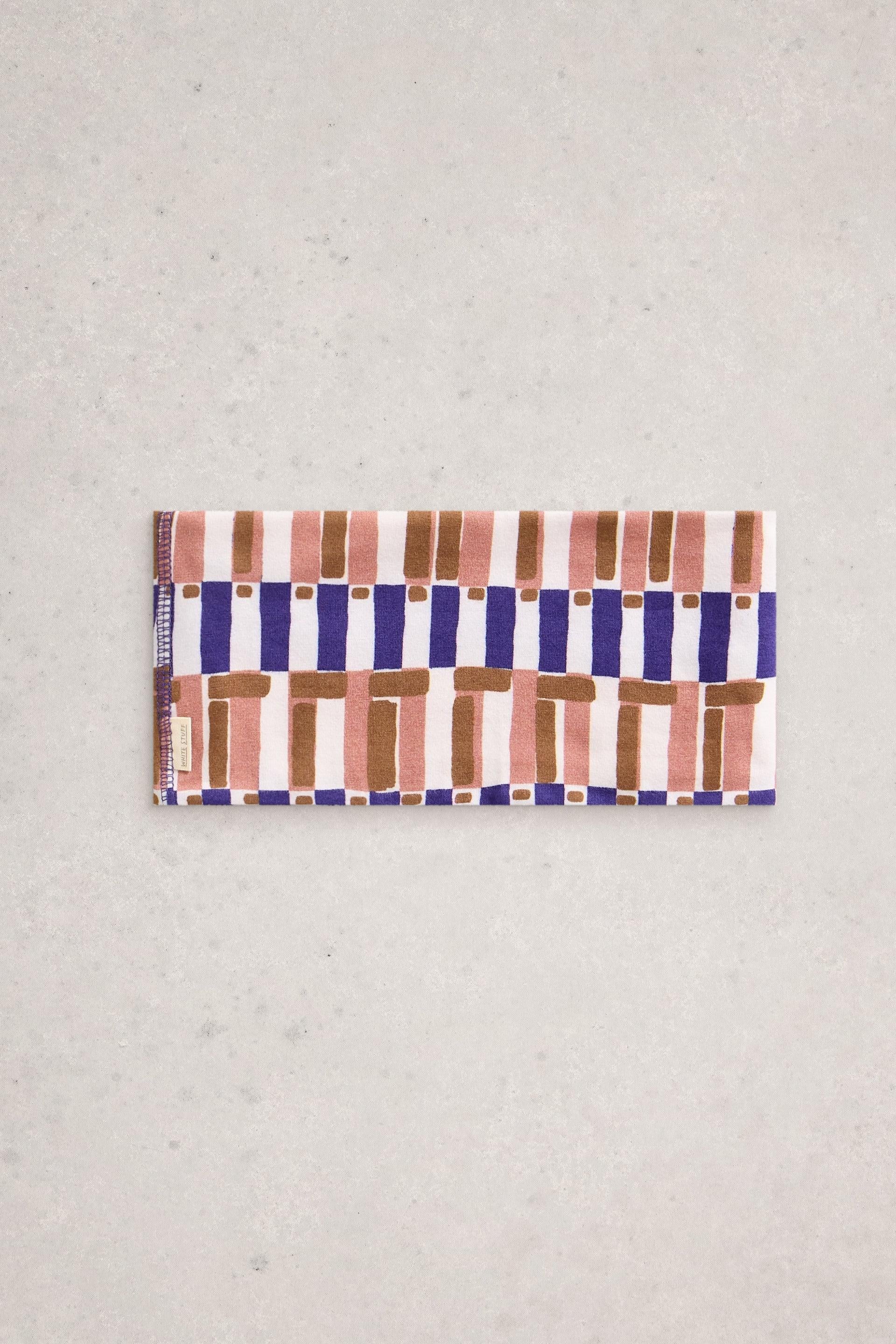 Rectangular fabric headband with abstract geometric block print pattern by White Stuff