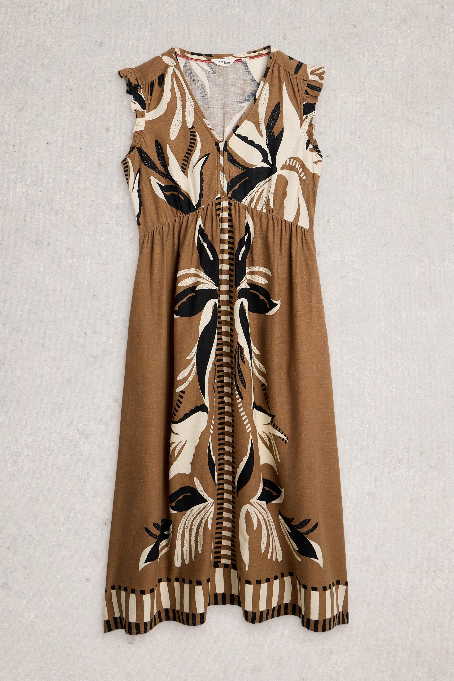 Brown dress with black and white floral pattern on a light gray background