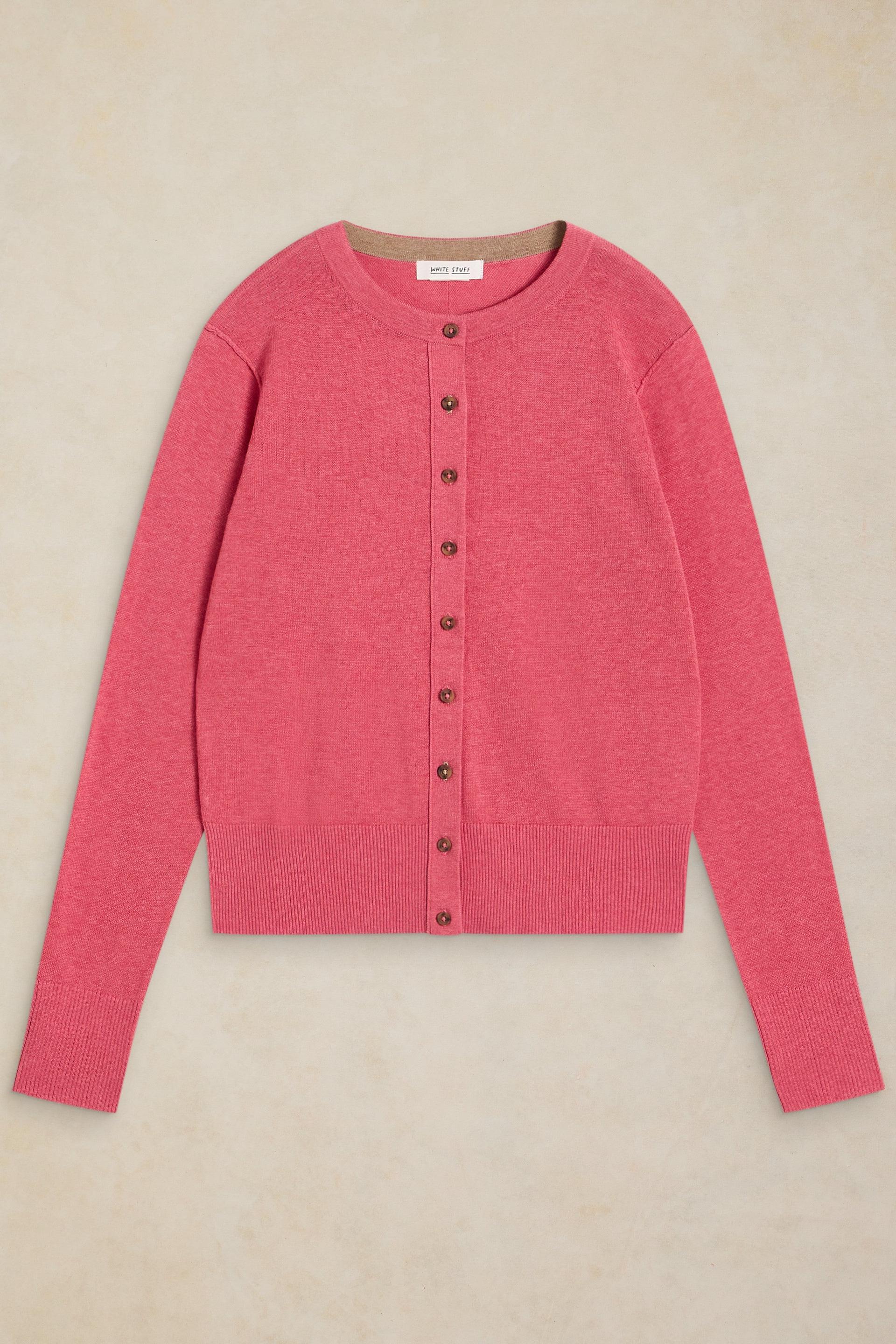 Pink long-sleeve organic cotton cardigan by White Stuff with button-down front against a neutral backgroun