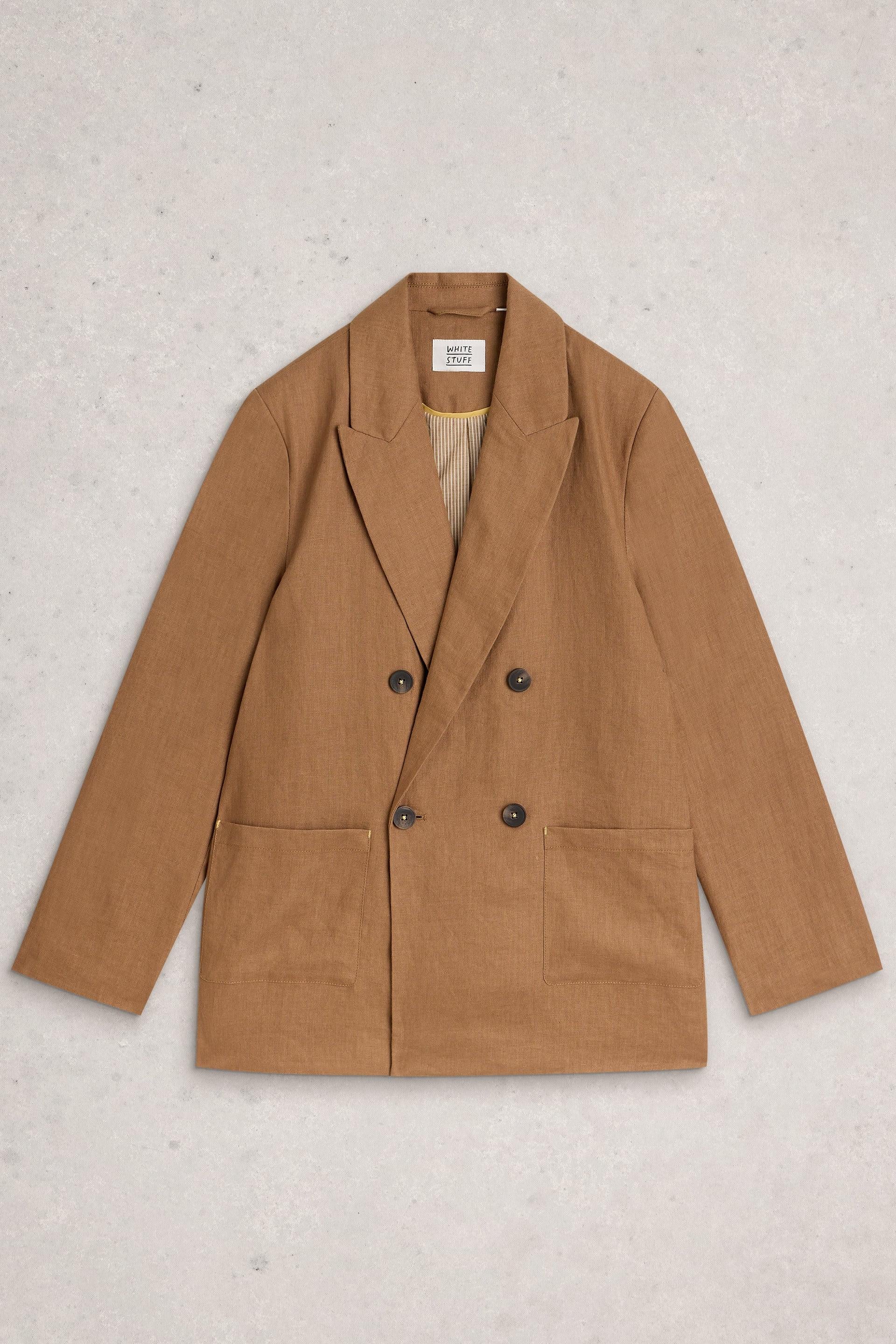 Brown linen blazer on a light gray background