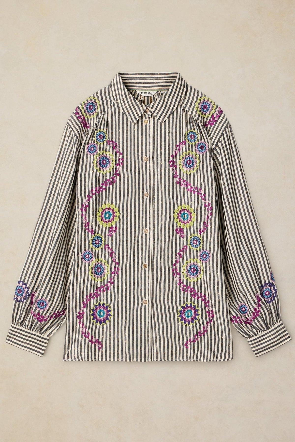 White Stuff women's striped shirt with colorful floral embroidery on a neutral background.